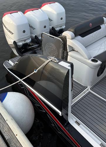 2017 Mystic Powerboats M4200 with triple Mercury outboard engines docked.