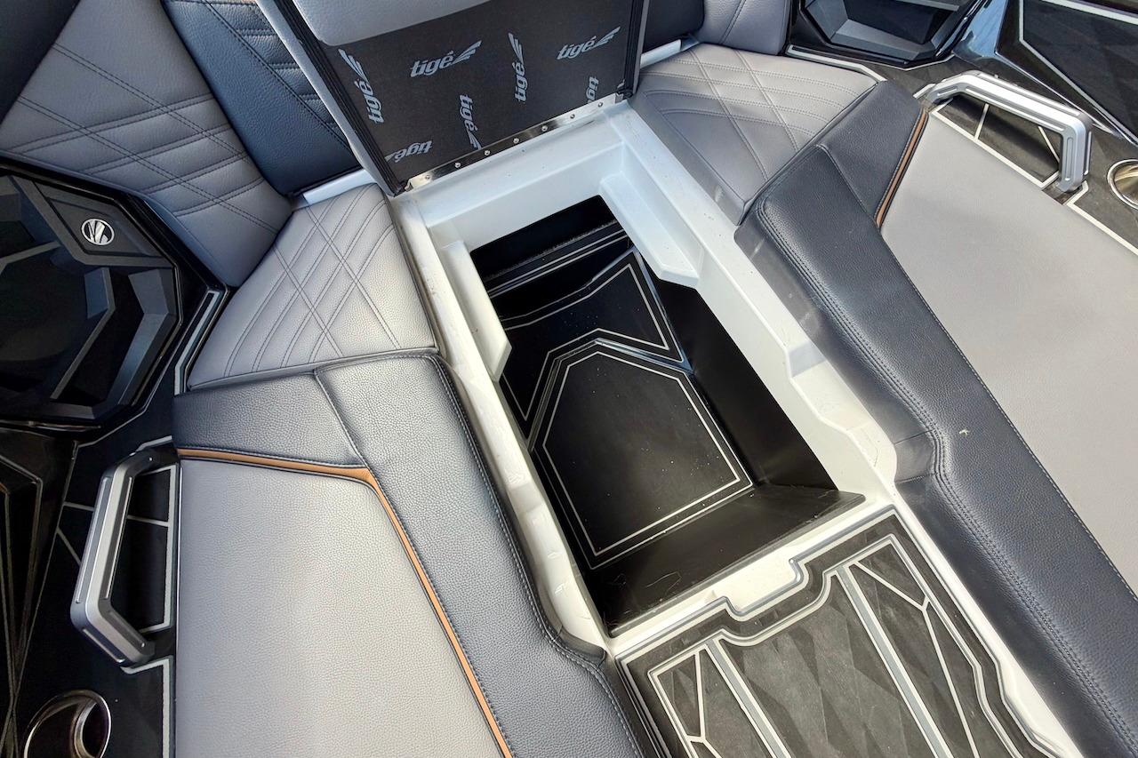 Interior seating and storage of 2025 Tigé Ultré 25ZX boat, featuring sleek design and premium materials.