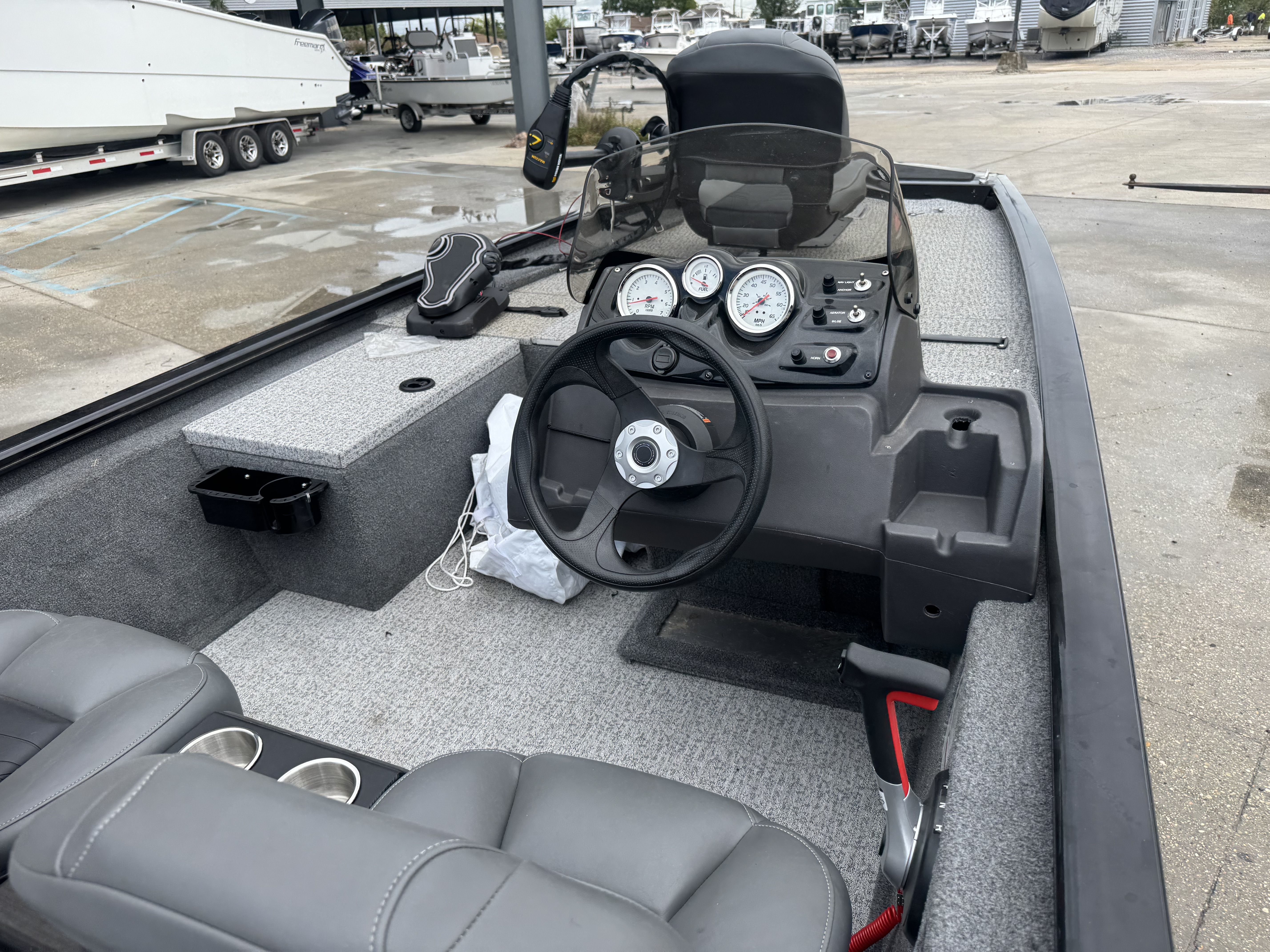 2024 Tracker Pro 170 boat interior with steering wheel and dashboard controls.