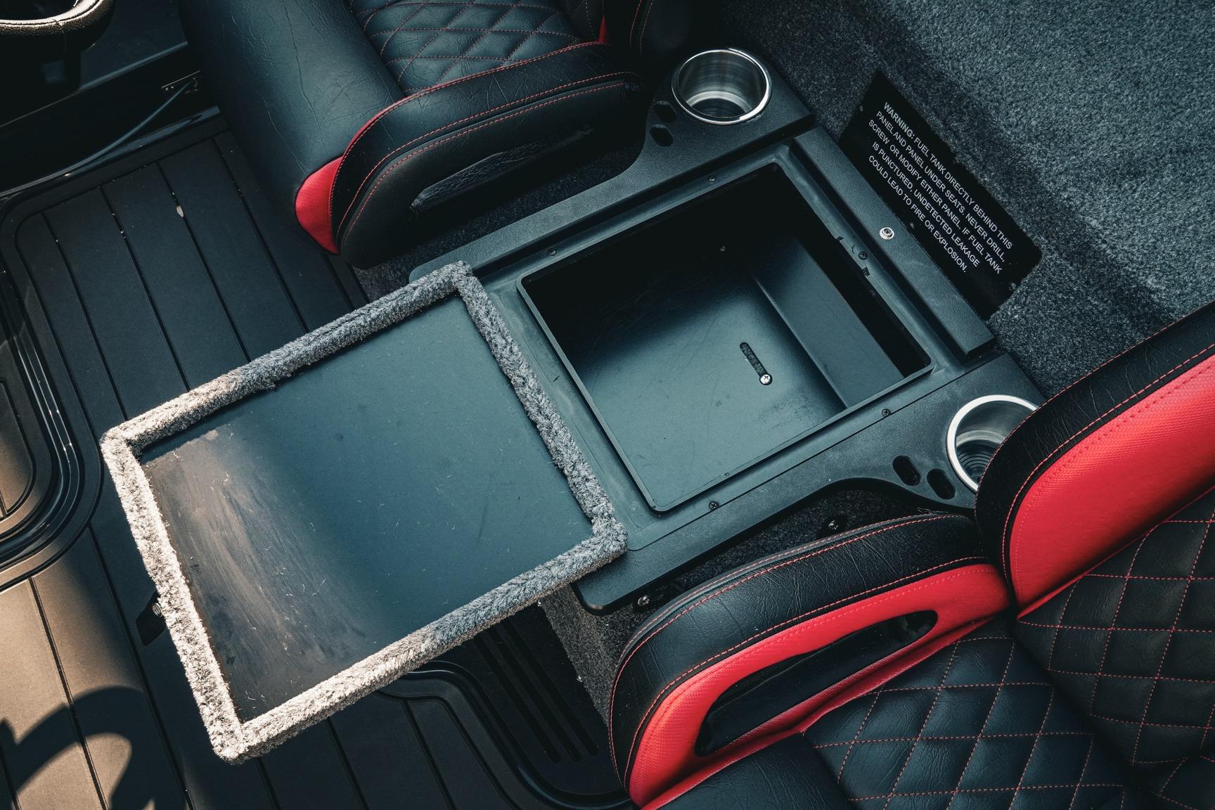 Interior of 2026 Phoenix 721 ZXL with storage compartment and cup holders.