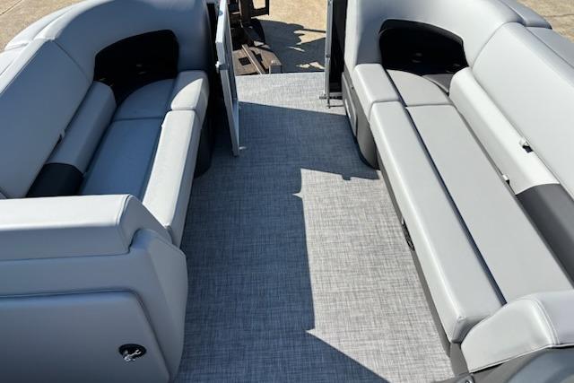 2026 Sun Tracker Party Barge 20 DLX interior with gray seating and spacious layout.