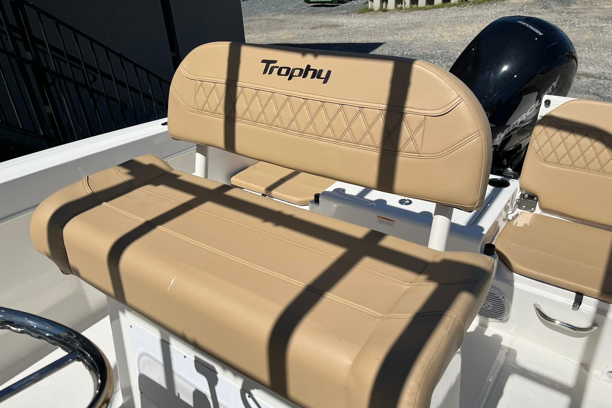2026 Bayliner Trophy T22CC boat seat with tan upholstery and "Trophy" logo.