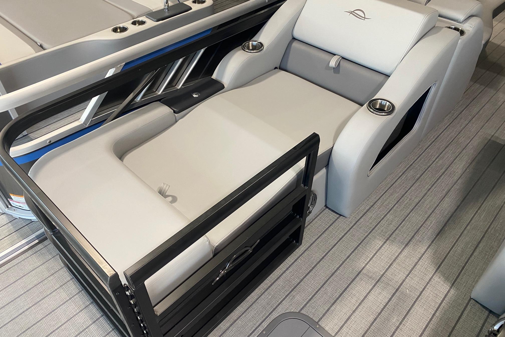 Luxurious seating on 2026 SunCatcher Fusion 324SS boat with cup holders and sleek design.