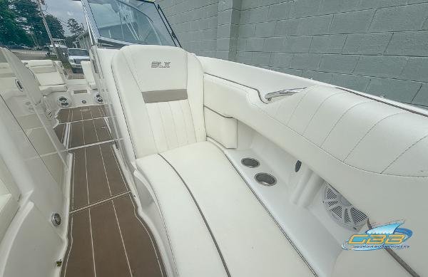 2008 Sea Ray 270 SLX boat interior with white leather seating and wood flooring.
