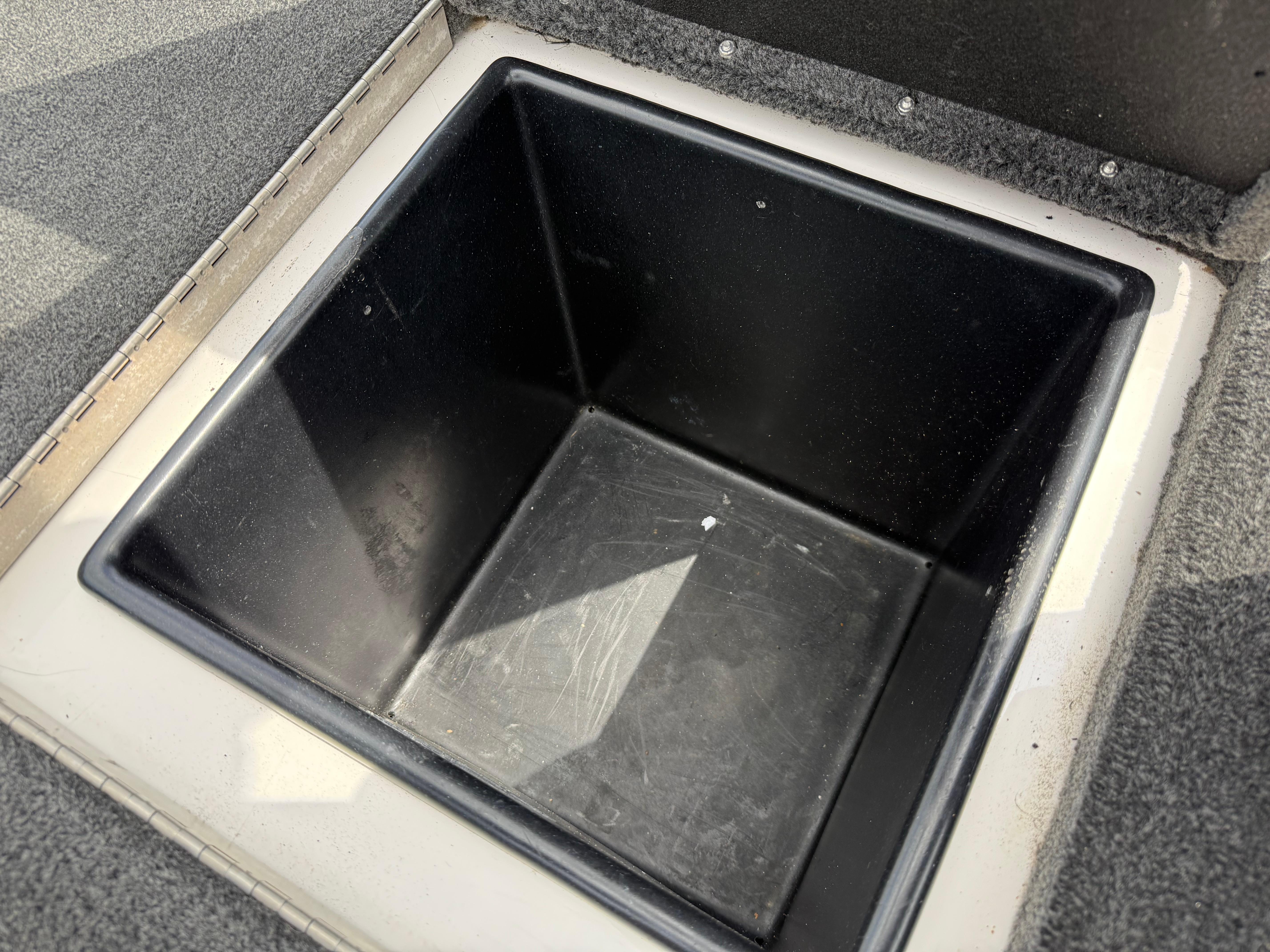 Interior of a 2003 Skeeter SX190 boat, empty storage compartment.