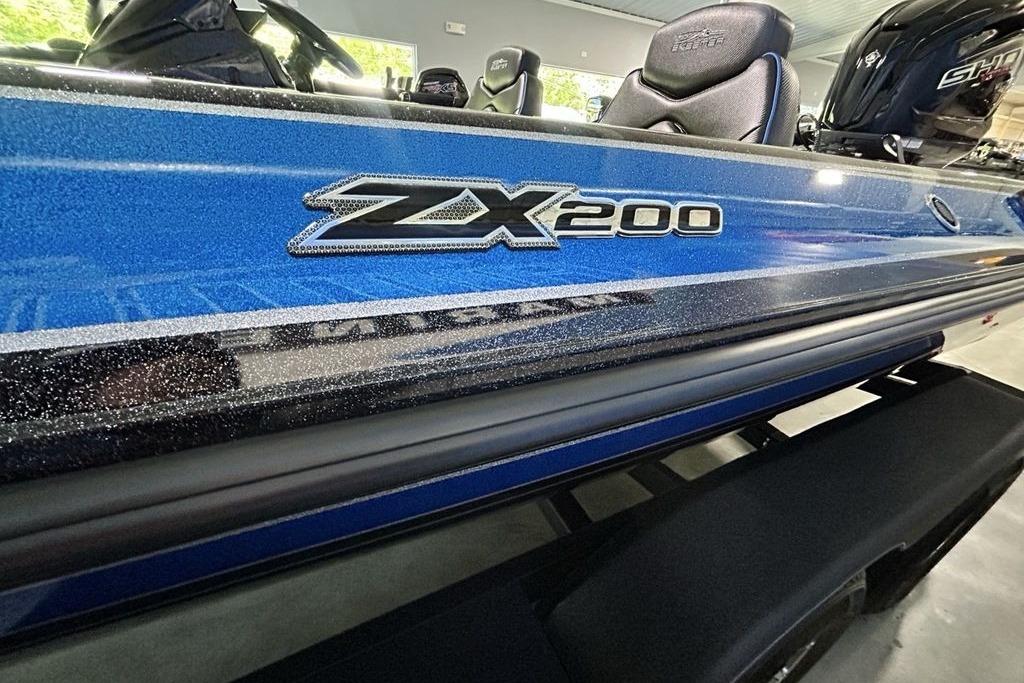 2026 Skeeter ZX200 boat with blue metallic finish in showroom.