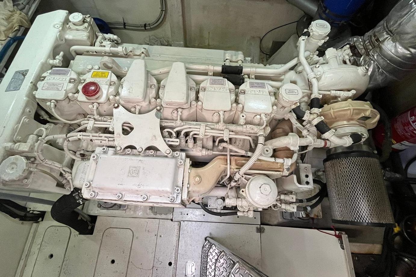 Engine room of 2009 Queens Yachts QUEENS 54, showcasing detailed mechanical components.