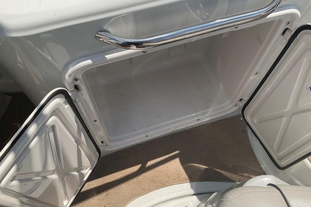 Open storage compartment on a 2015 Crownline 236 SC boat, featuring a sleek design.