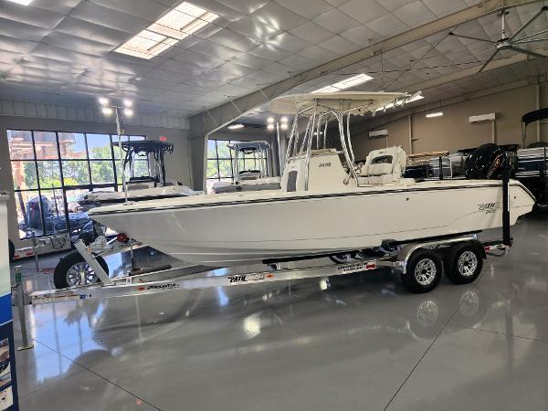 2025 Pathfinder 2400 Open boat on trailer in showroom.