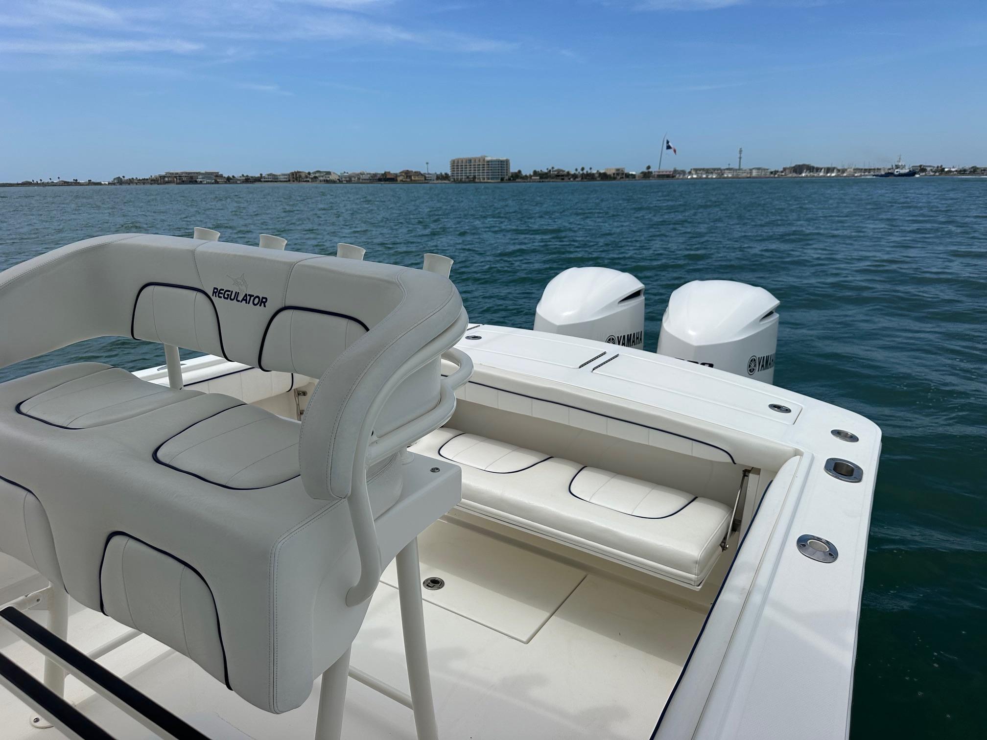 2016 Regulator center console boat with Yamaha engines on open water.