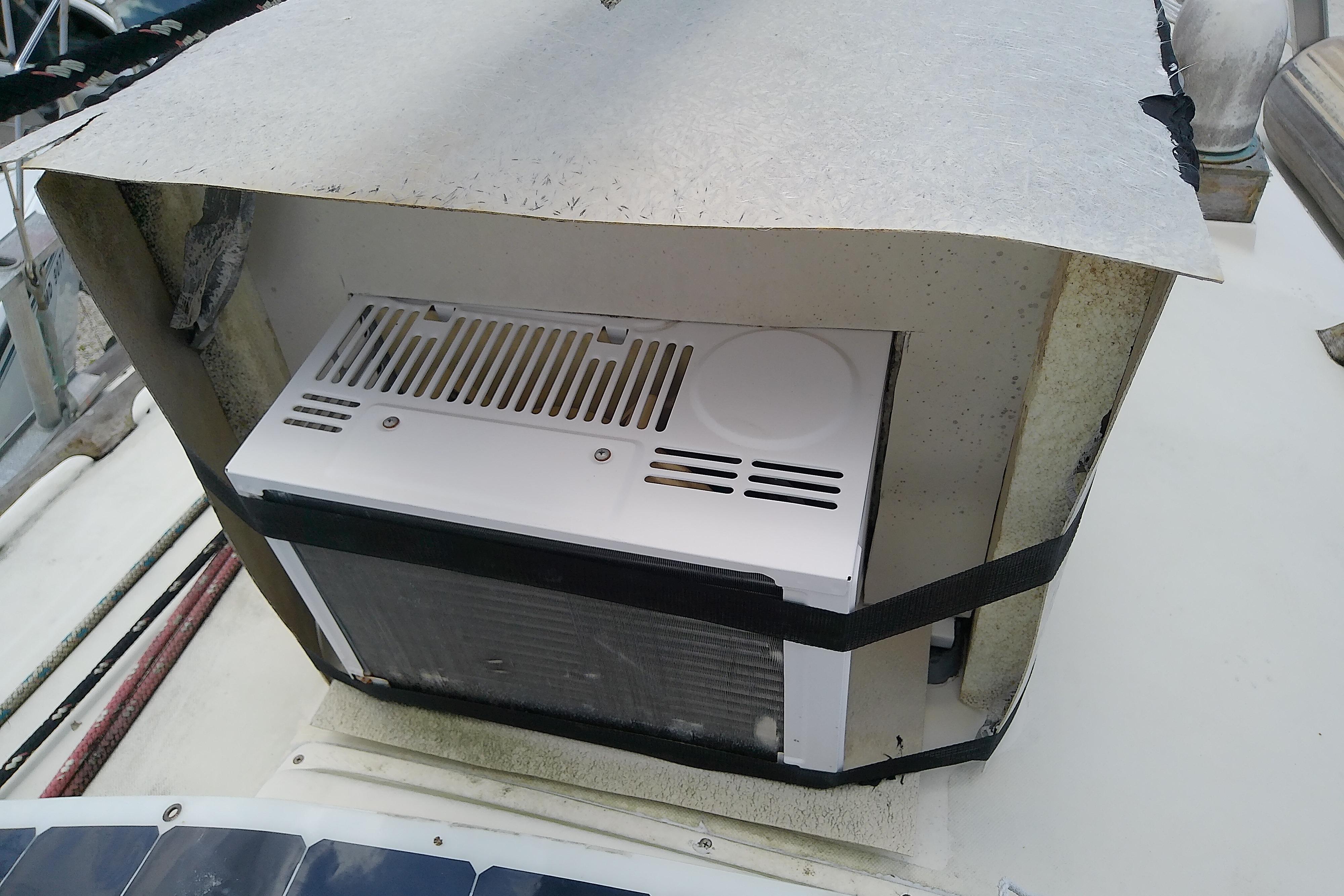 1981 Sea Sprite 34 boat with a mounted air conditioning unit on deck.