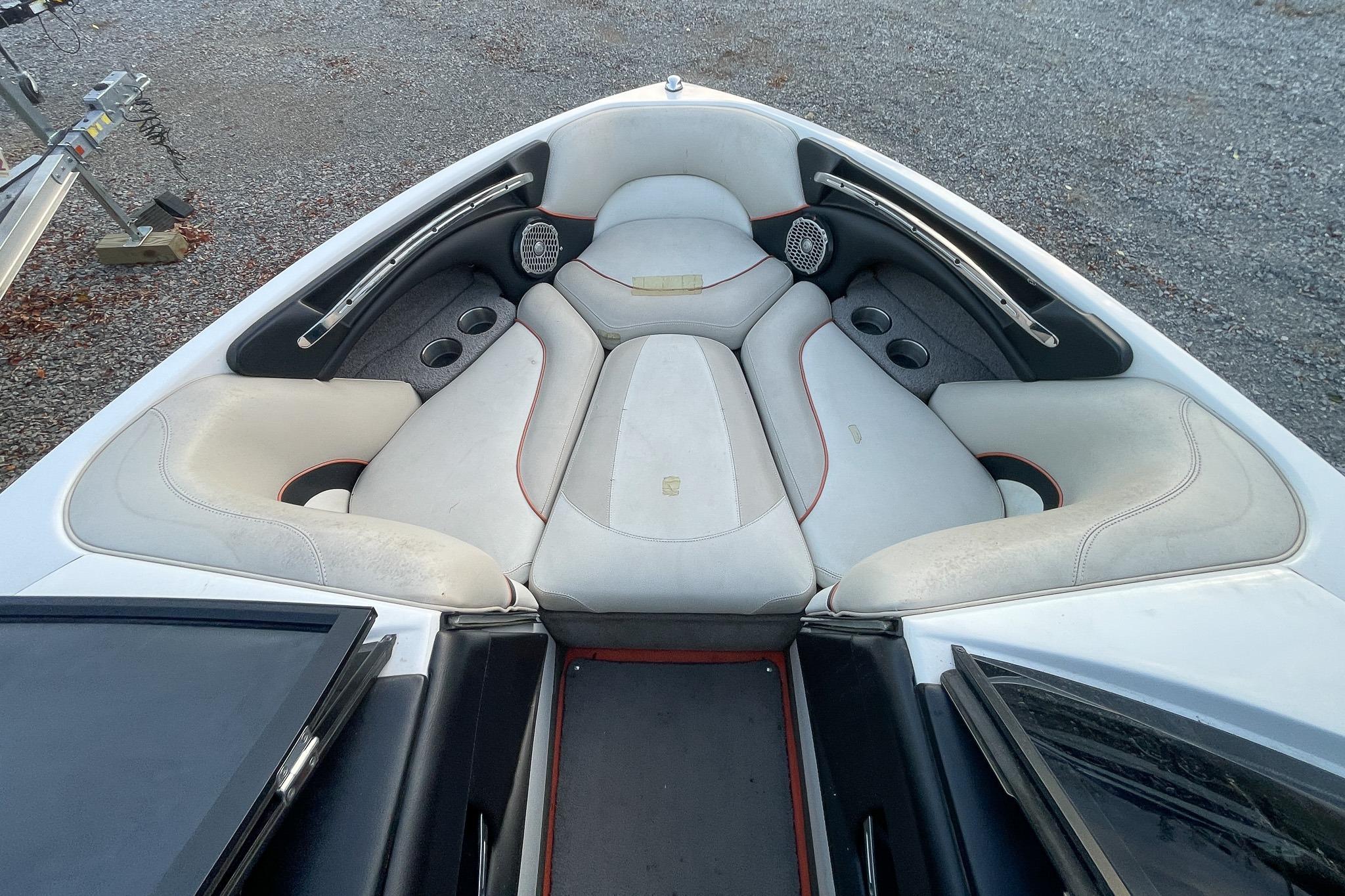 Interior of 2011 Malibu Wakesetter 21 VLX boat with cushioned seating.