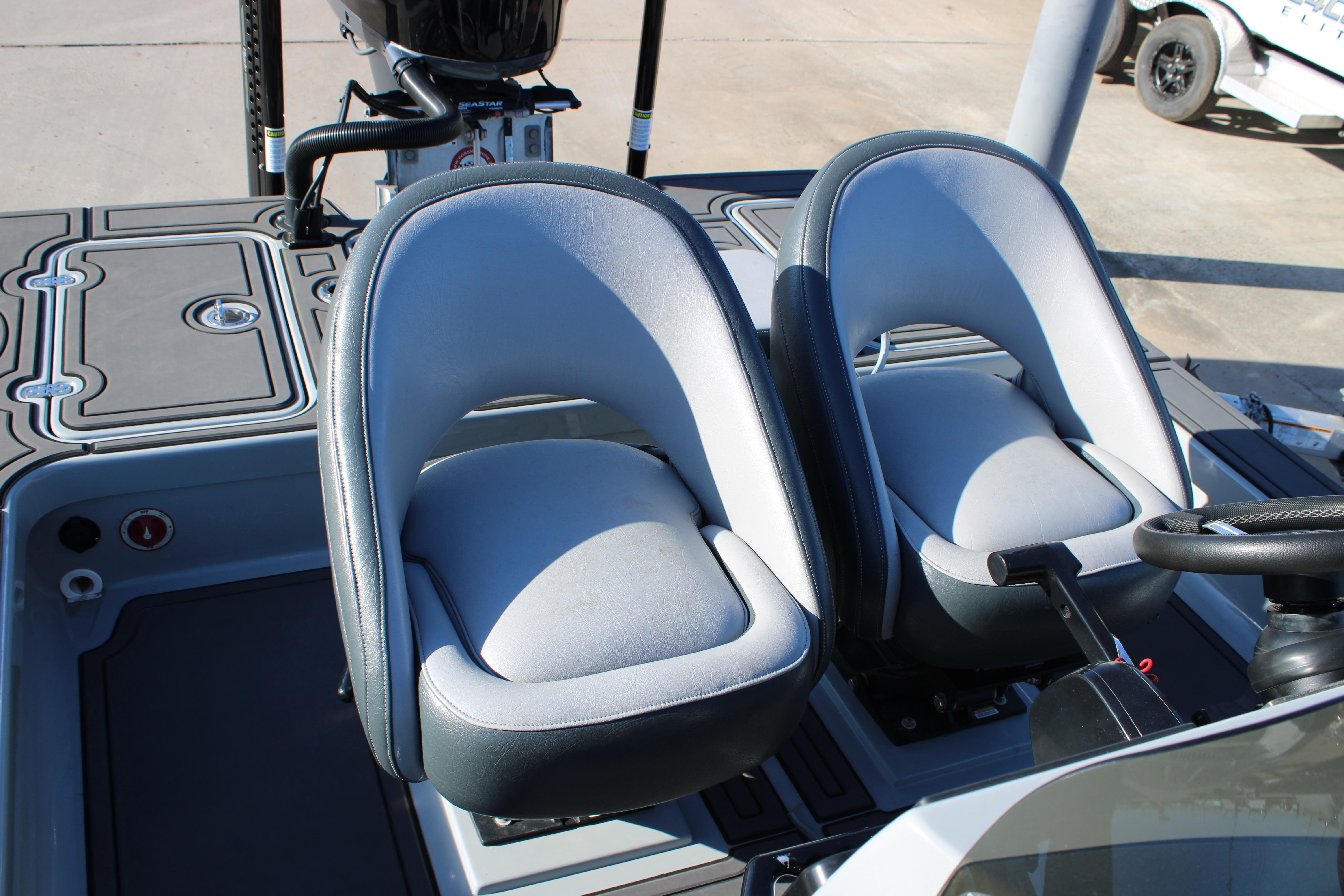 Dual seats on 2025 Mamba 227VX boat, featuring sleek design and modern controls.