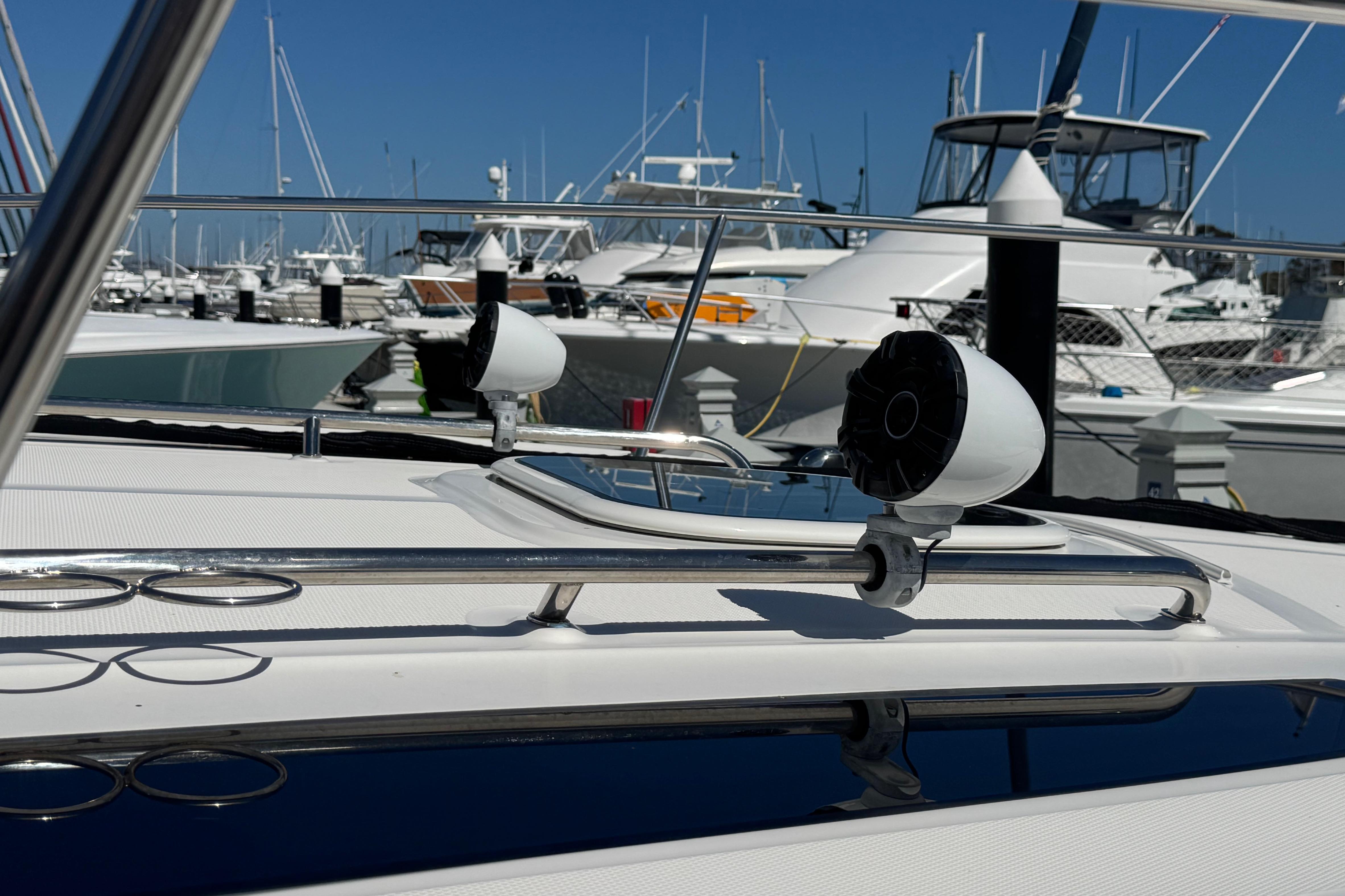 2016 Sea Ray Sundancer 350 yacht docked at marina with clear blue sky.