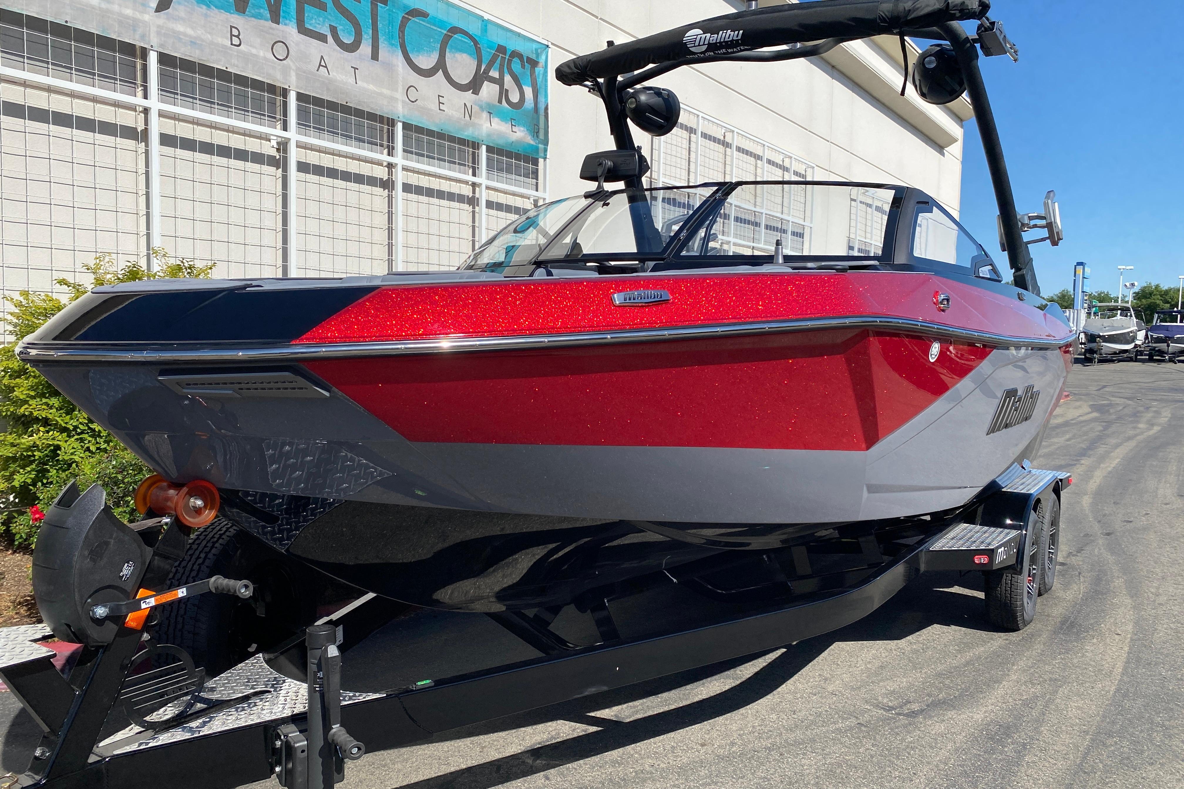 2025 Malibu Wakesetter 23 LSV boat in vibrant red and gray, displayed at West Coast Boat Center.