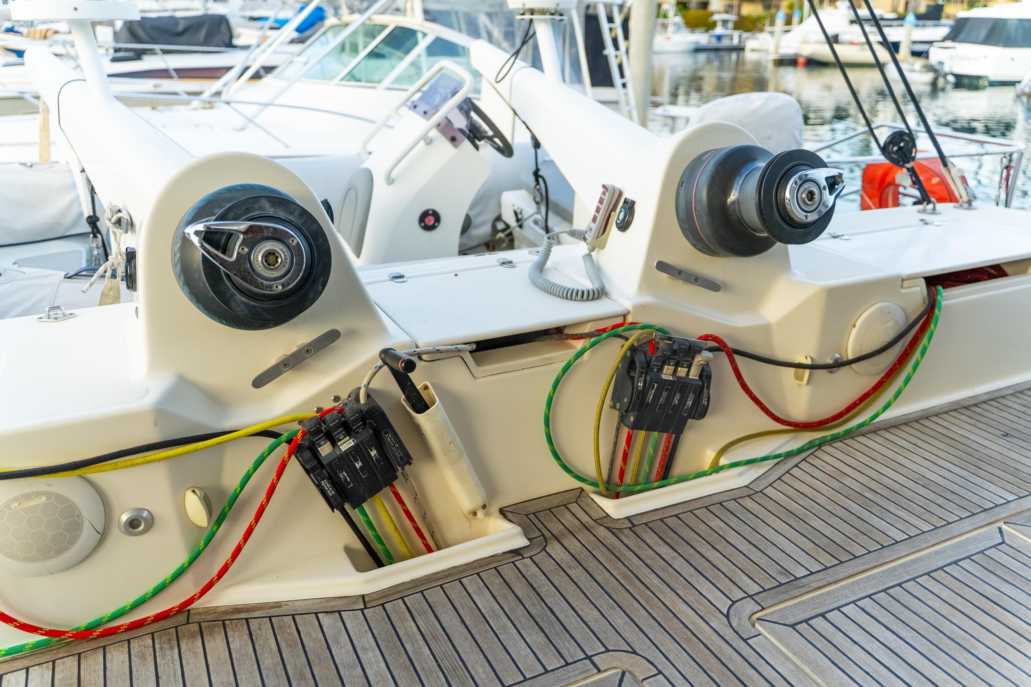 Deck of 2009 Catana 65 yacht with winches and colorful ropes.