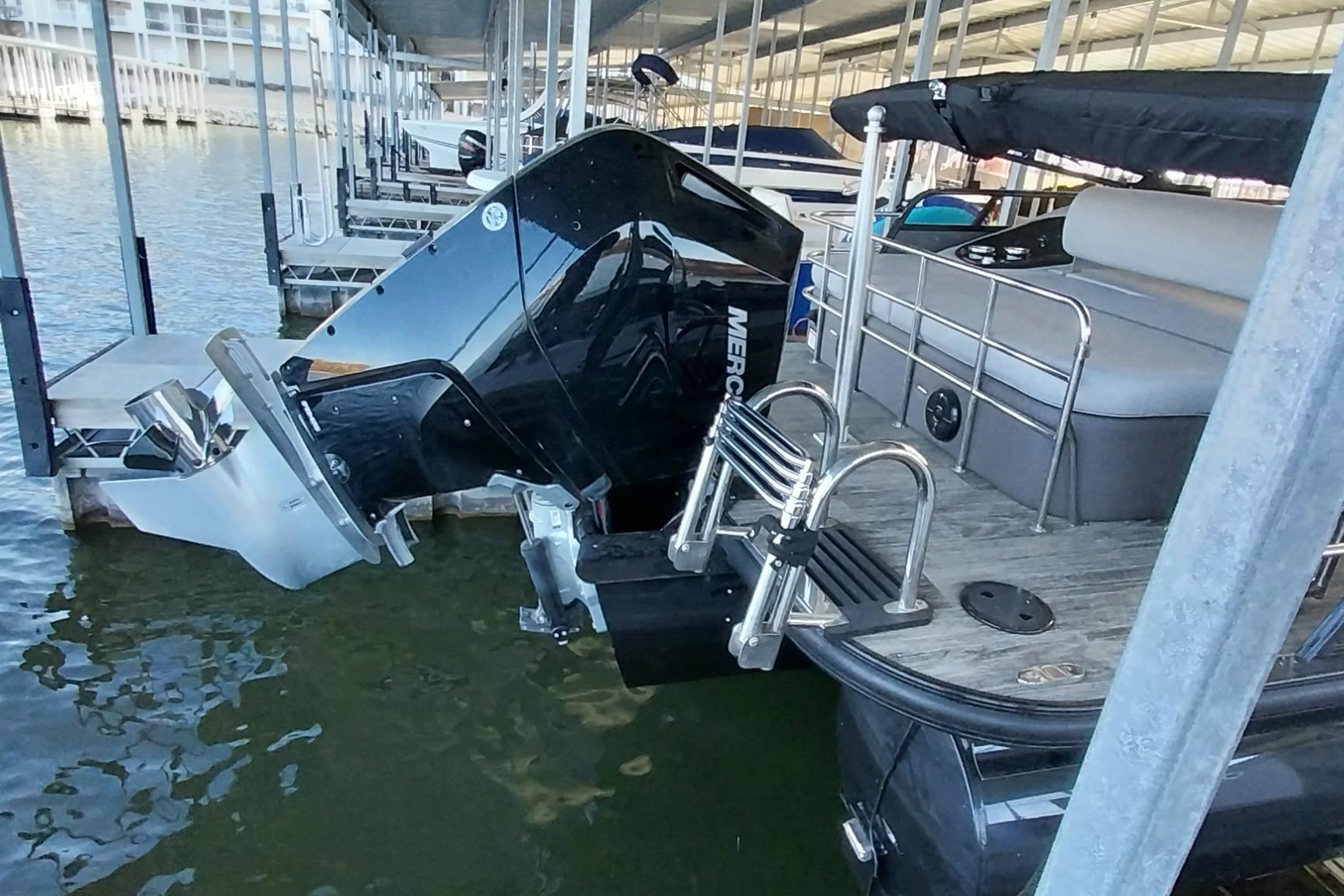 2023 Ranger 2500LS boat docked with Mercury outboard motor in marina.