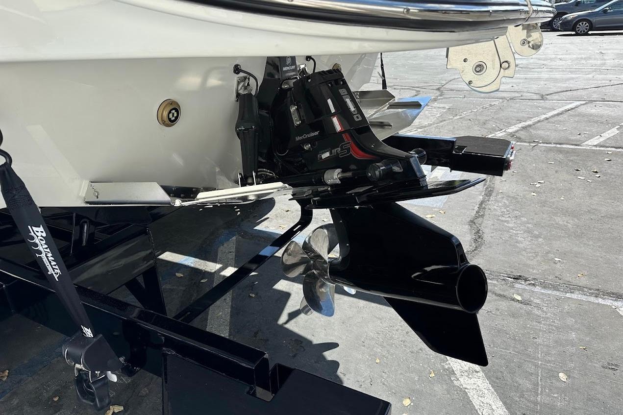 2026 Sea Ray SDX 230 Surf boat stern with MerCruiser engine and propeller.