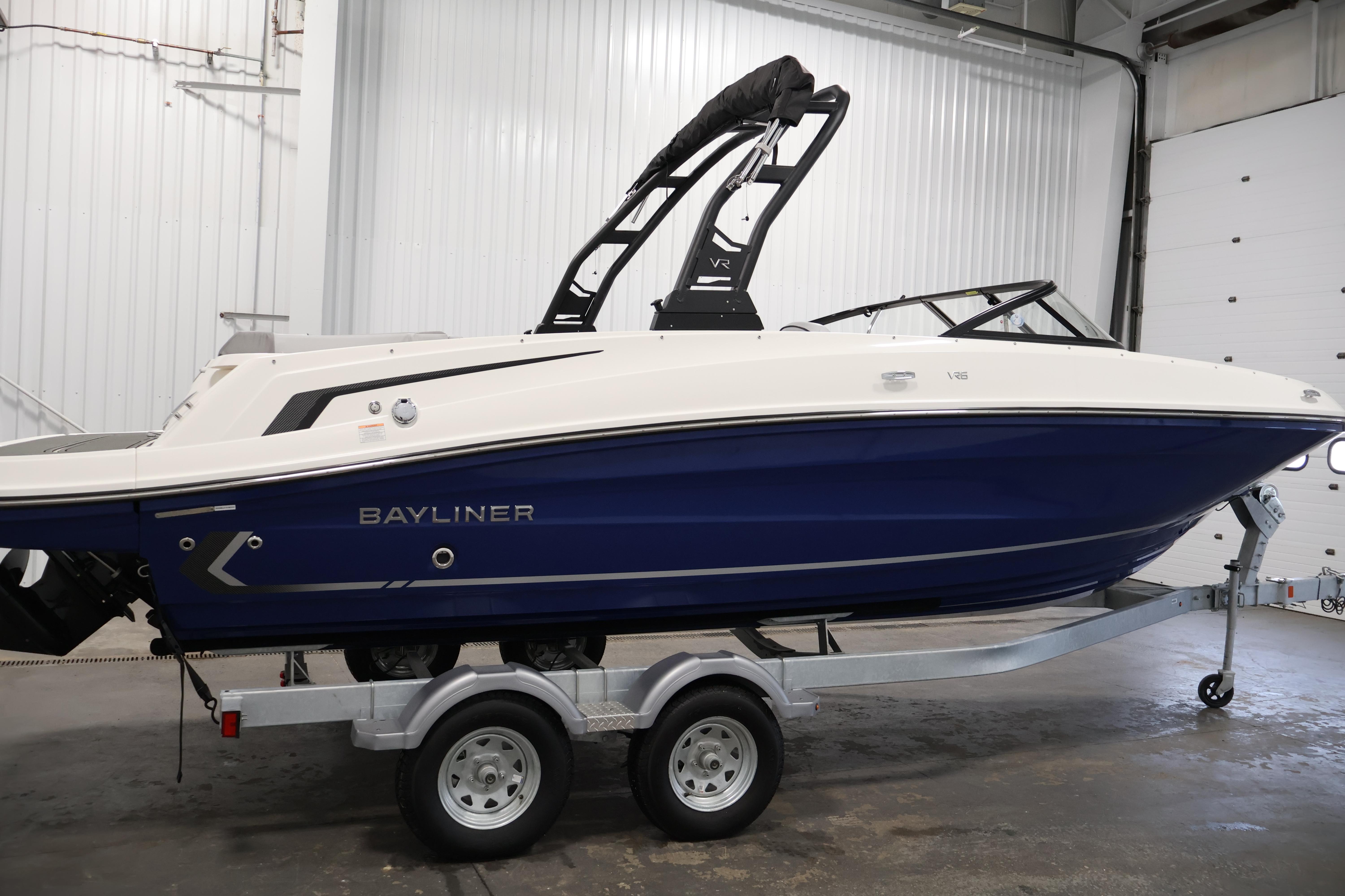 2026 Bayliner VR6 Bowrider I/O on trailer in indoor setting.