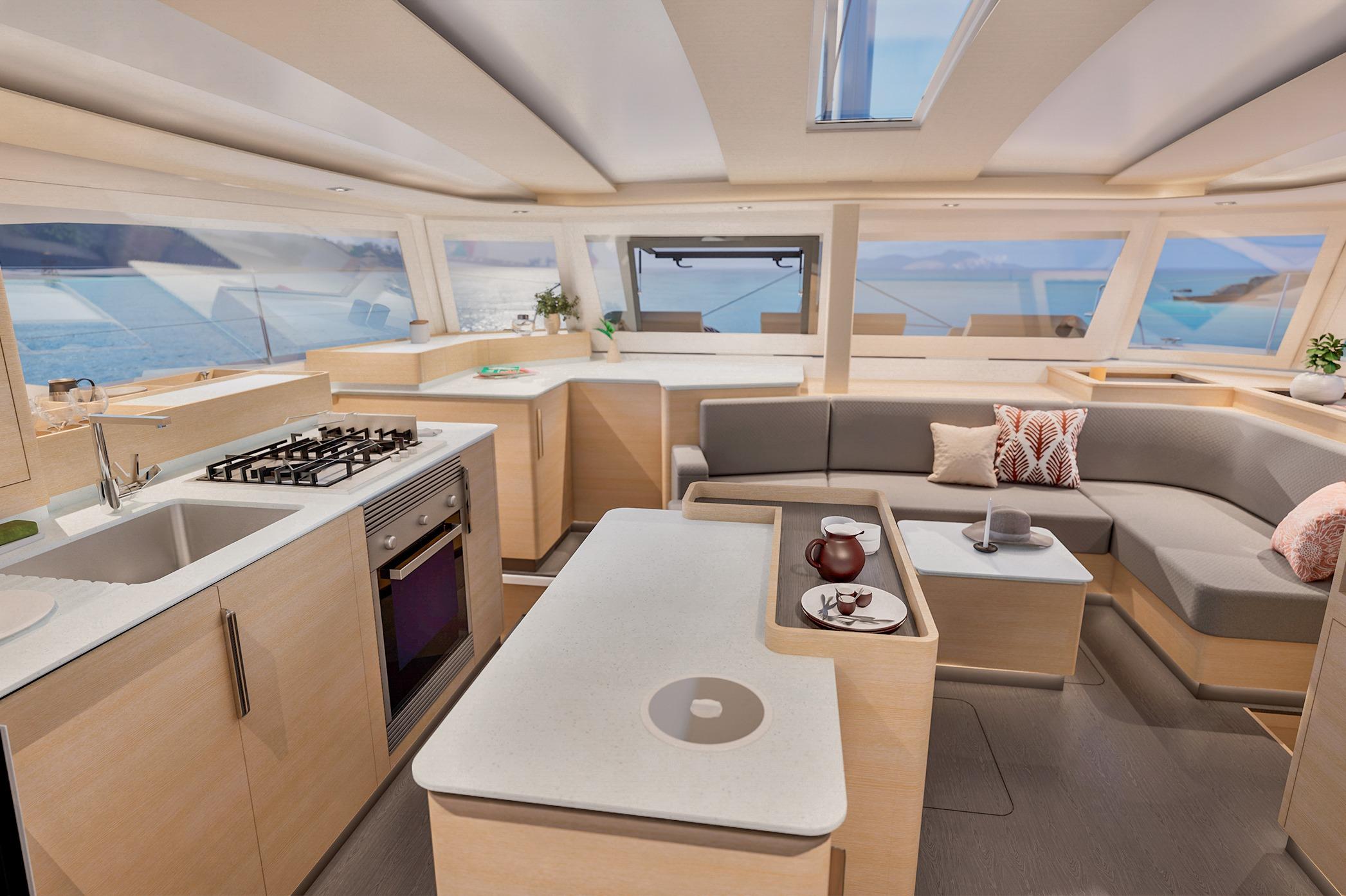 Luxurious interior of 2026 Fountaine Pajot FP 48 catamaran with modern kitchen and seating area.