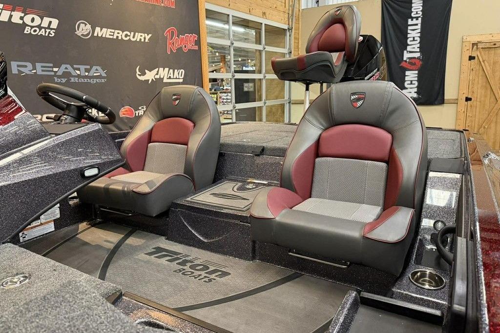 2026 Triton 20XP Patriot boat interior with stylish seating and steering wheel.