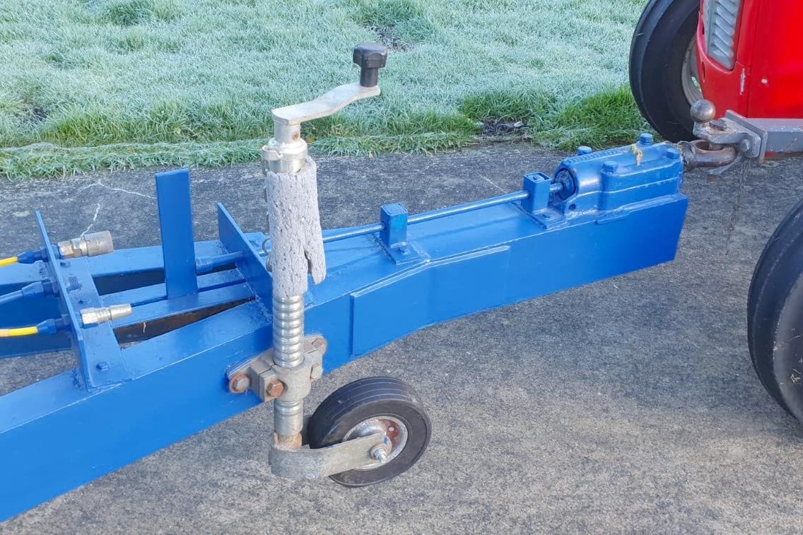 Blue trailer hitch attached to a red vehicle, featuring a Fairey Spearfish MKIII, 1989 model.
