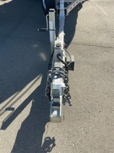 Trailer hitch of a 2025 Spartan 2600 Olympia on asphalt surface.