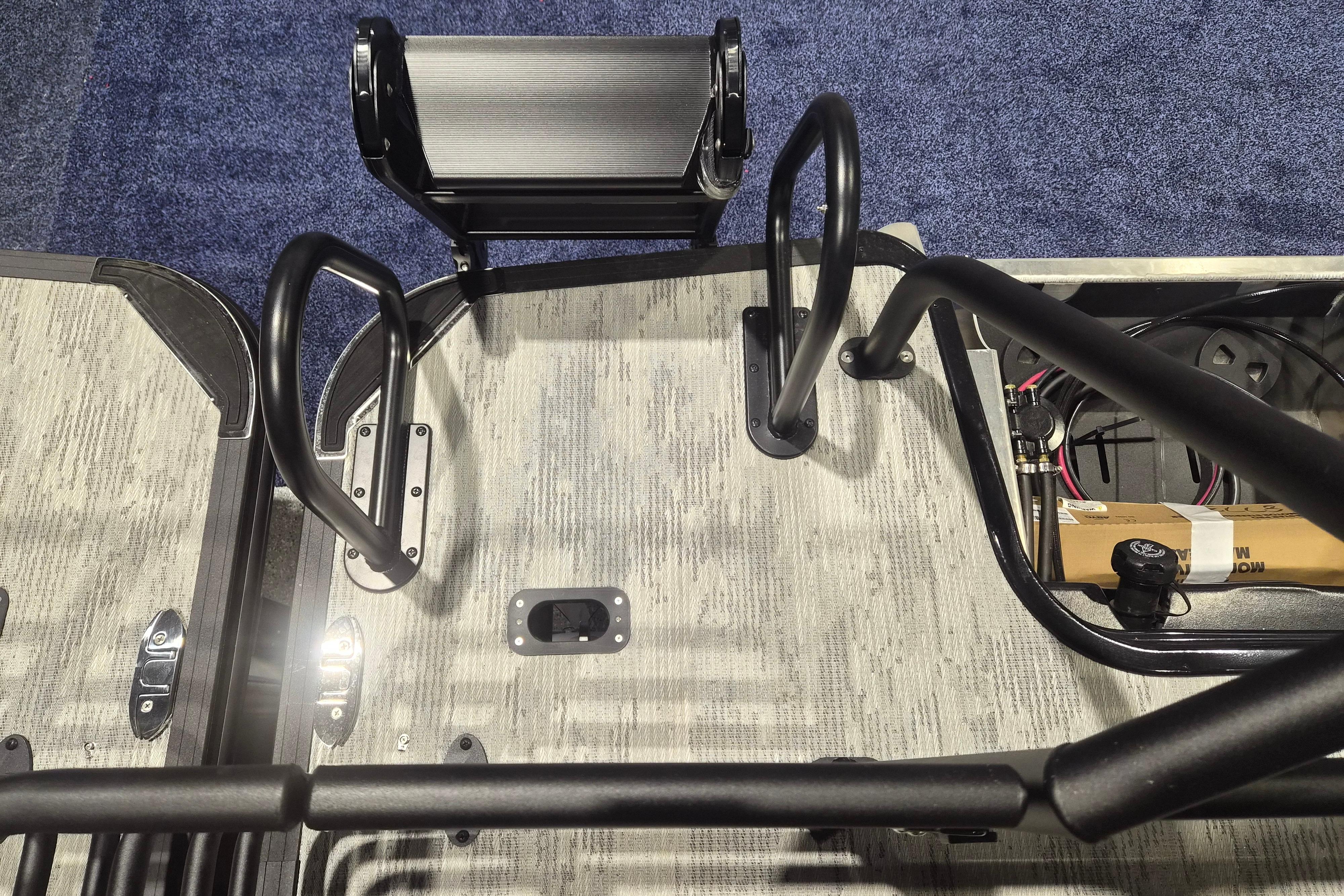 2026 Sylvan L3 ULZ boat deck with metal railings and textured flooring.