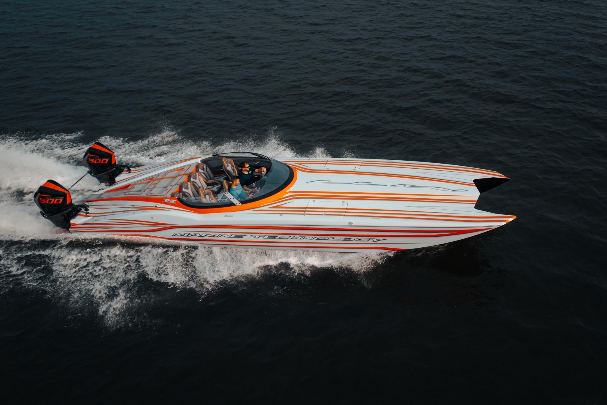 2024 MTI 390X speedboat with dual engines cruising on open water.
