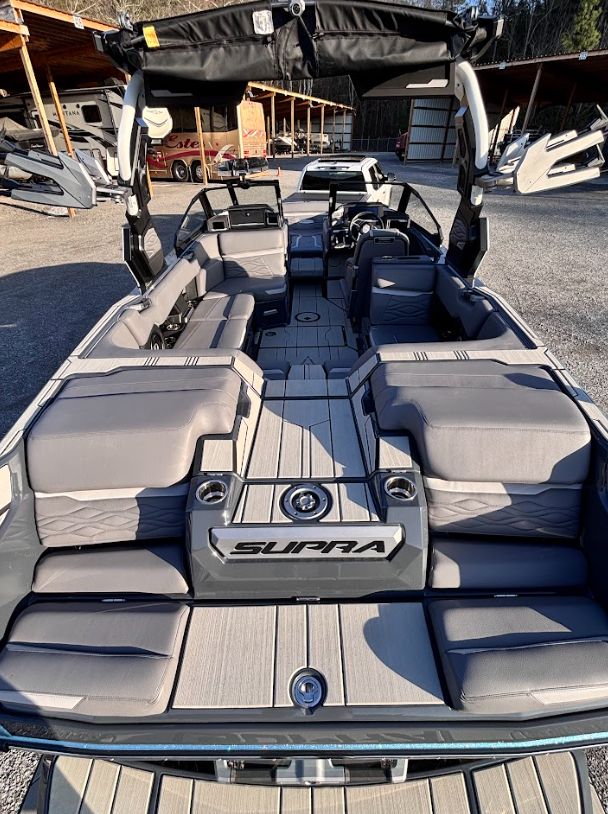 Interior of 2025 Supra SA 450 boat with luxurious seating.