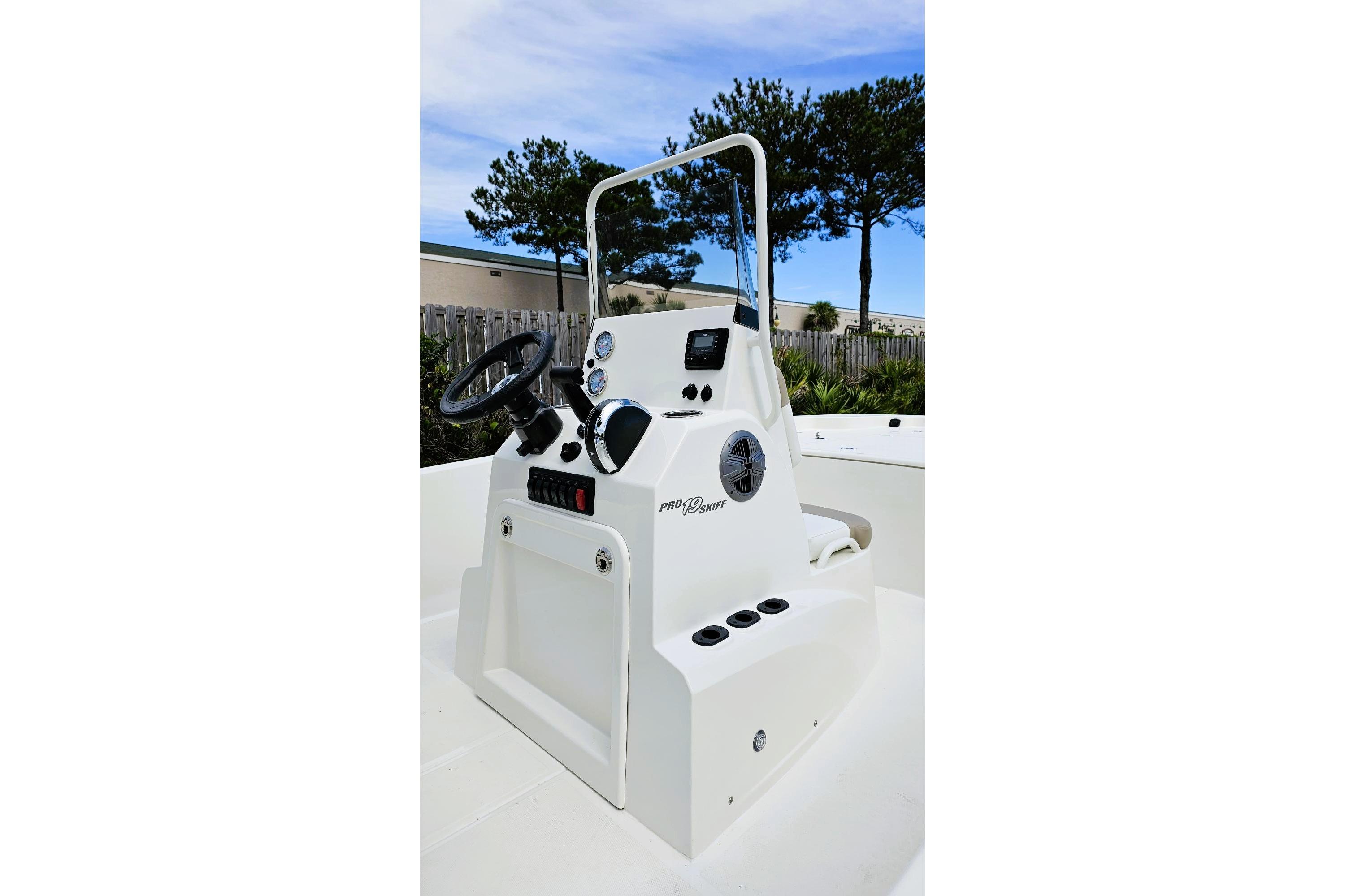2026 Mako Pro Skiff 19 CC boat console with steering wheel and controls.