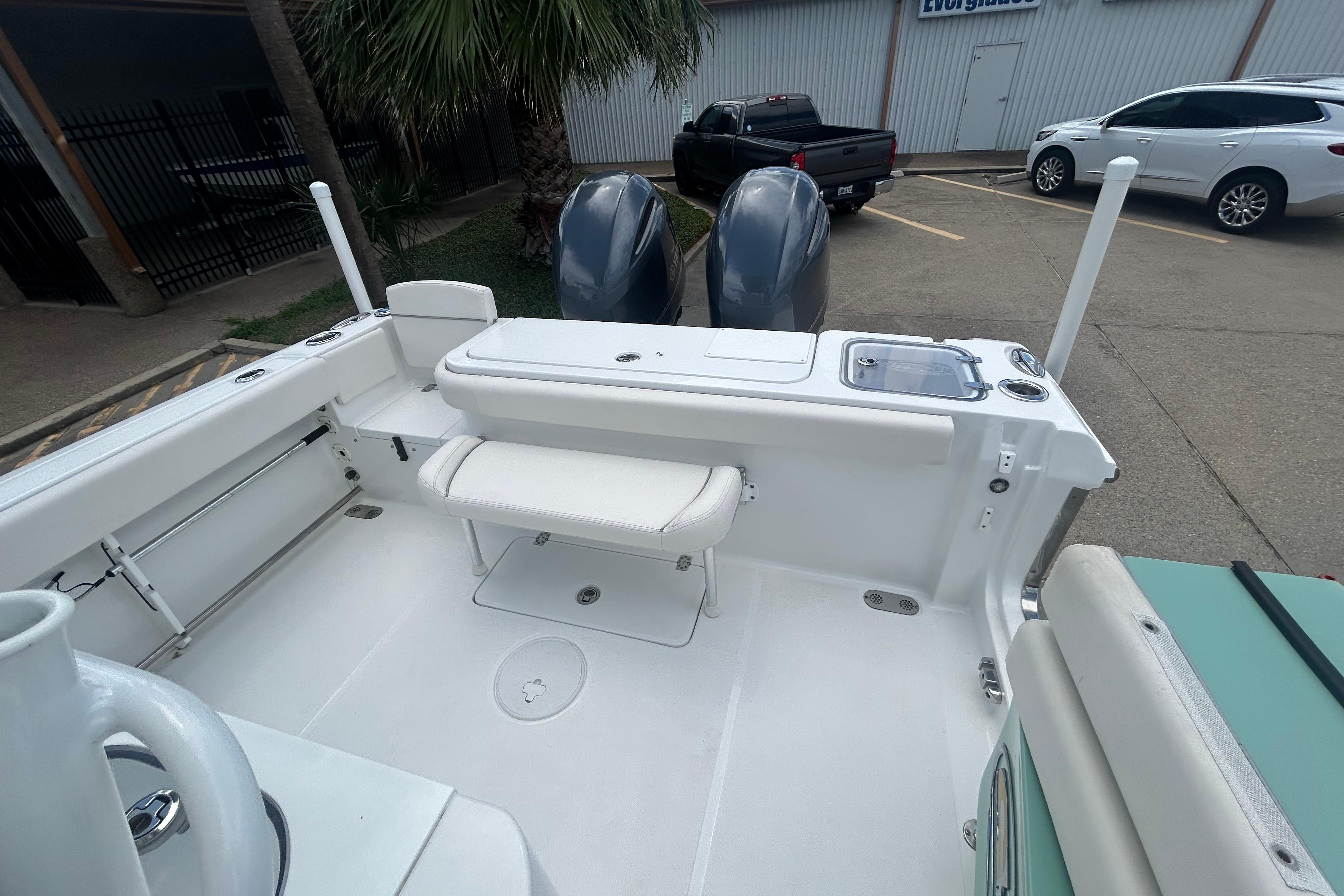 2023 Sea Hunt Gamefish 27 Coffin Box boat interior with dual engines and seating.
