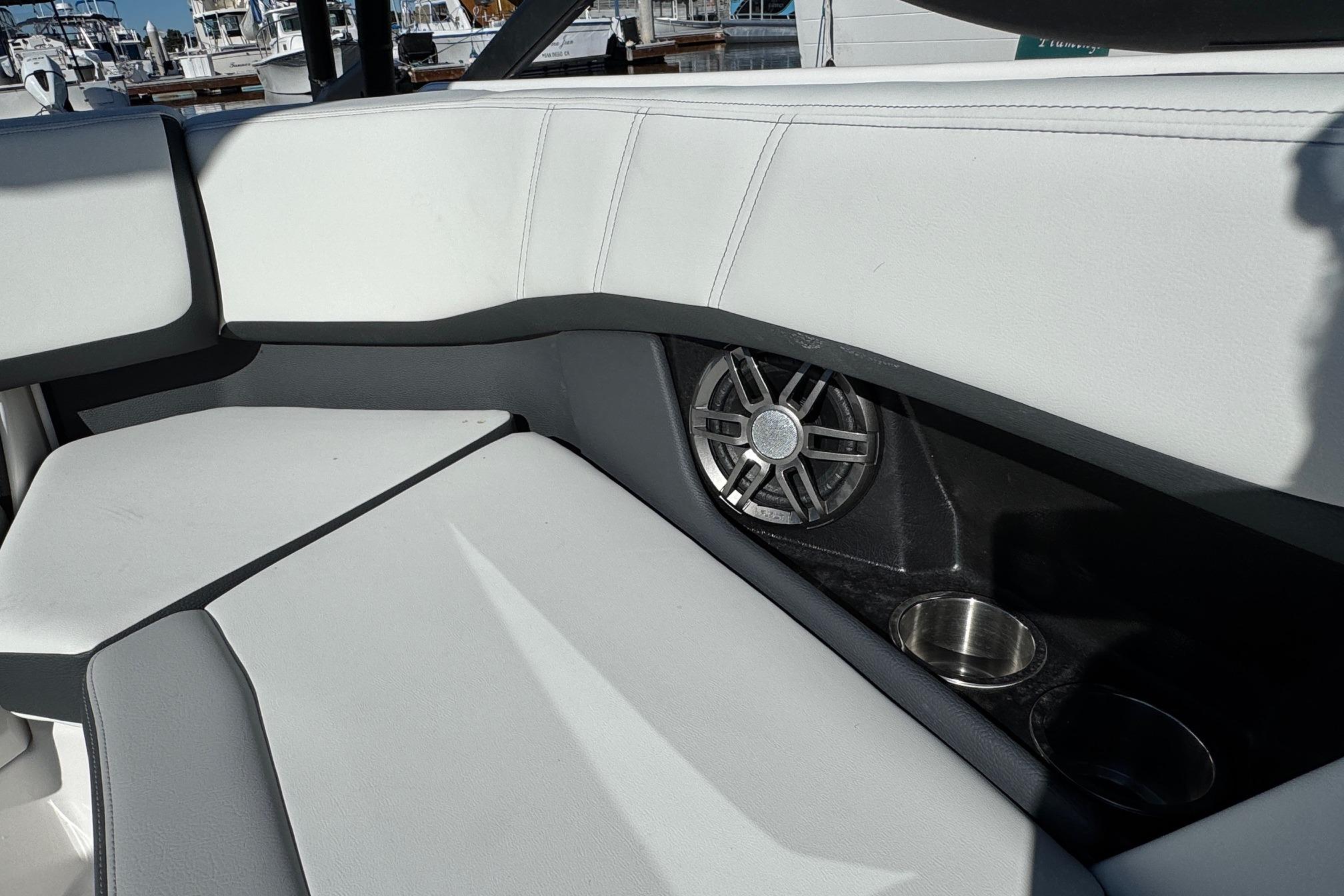 Interior of 2026 Regal 21 OBX boat with speaker and cup holders.