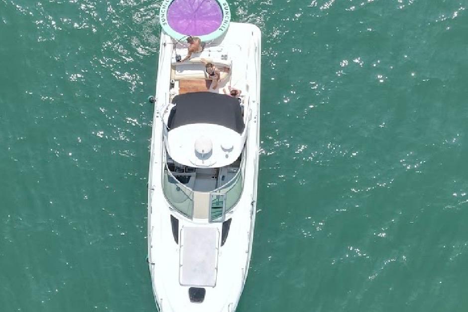 Aerial view of 2008 Sea Ray 350 Sundancer yacht on turquoise water.