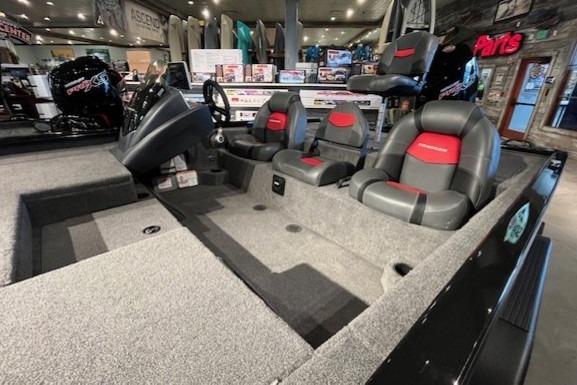 Interior of 2025 Tracker Savage 215 boat with modern seating and spacious layout.