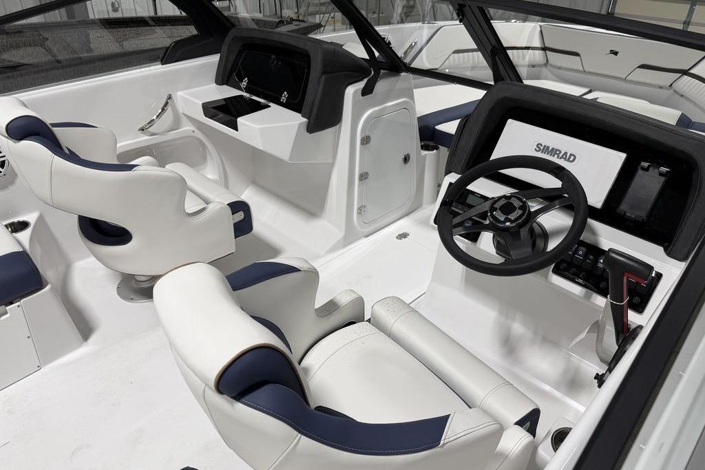 Interior of a 2027 Stingray 20 SBX boat with modern steering and seating.