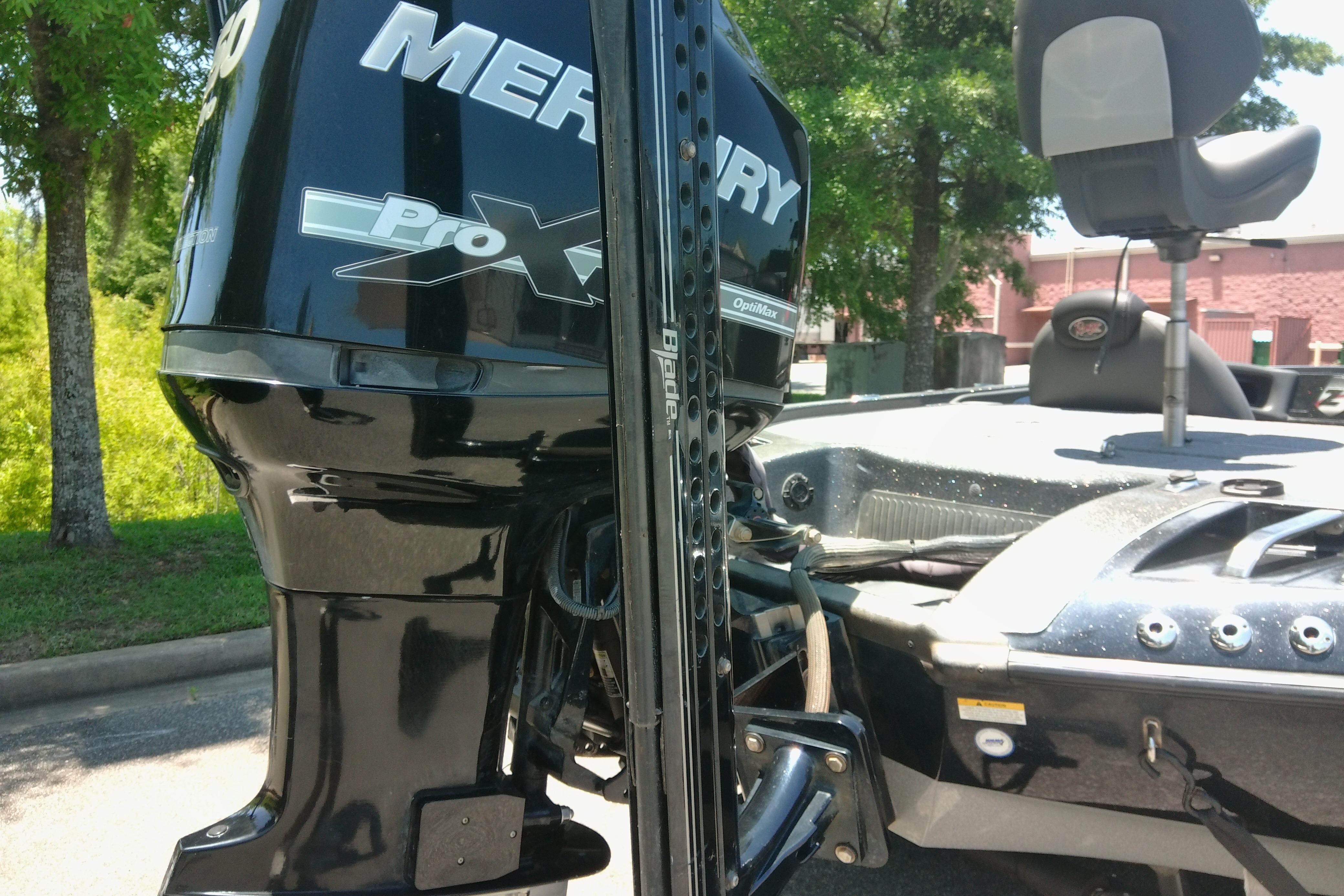 2012 Ranger Z520 boat with Mercury Pro XS engine, parked outdoors.