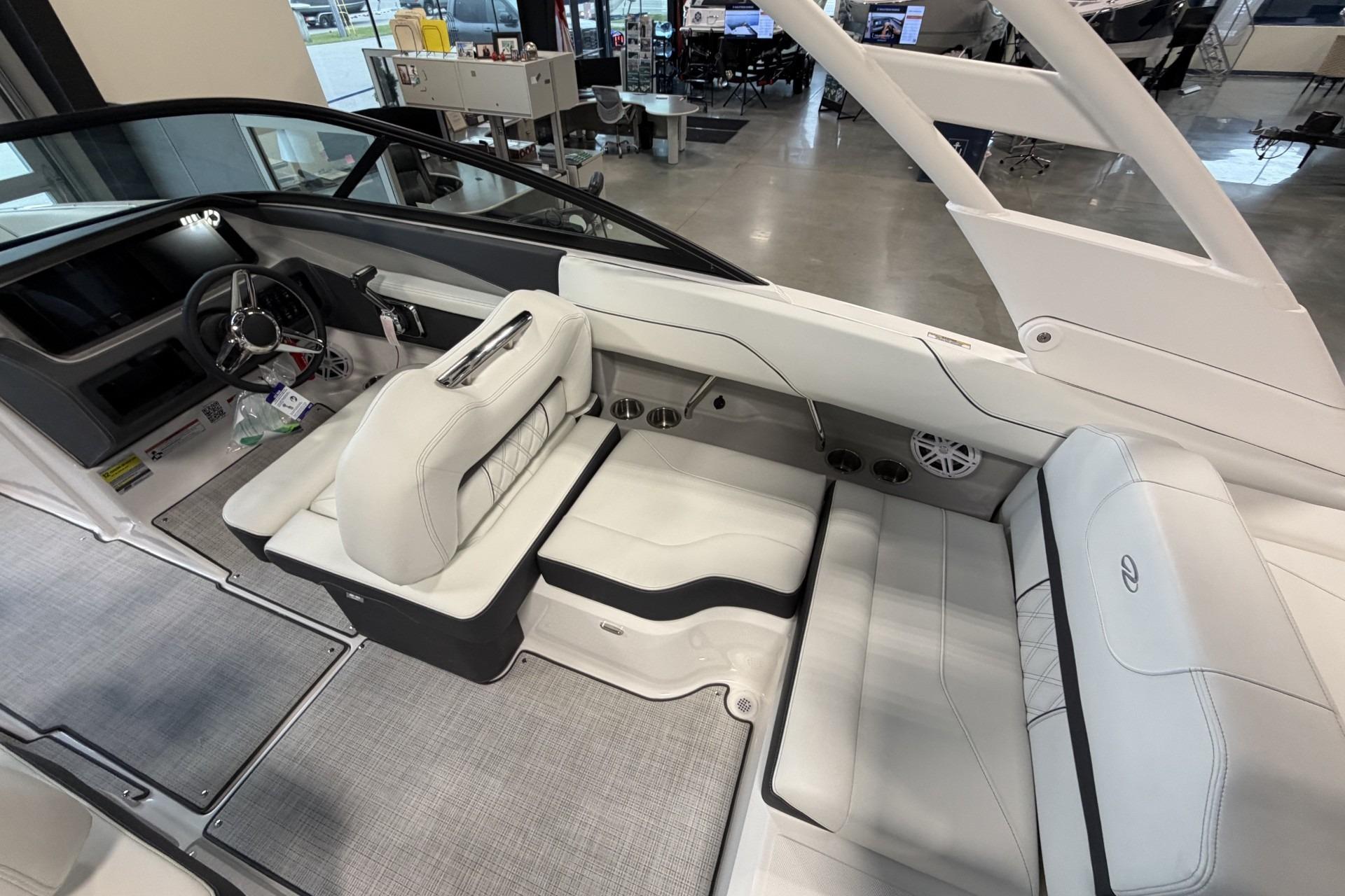 Interior of a 2027 Regal LS2 boat with luxurious white seating and modern dashboard.
