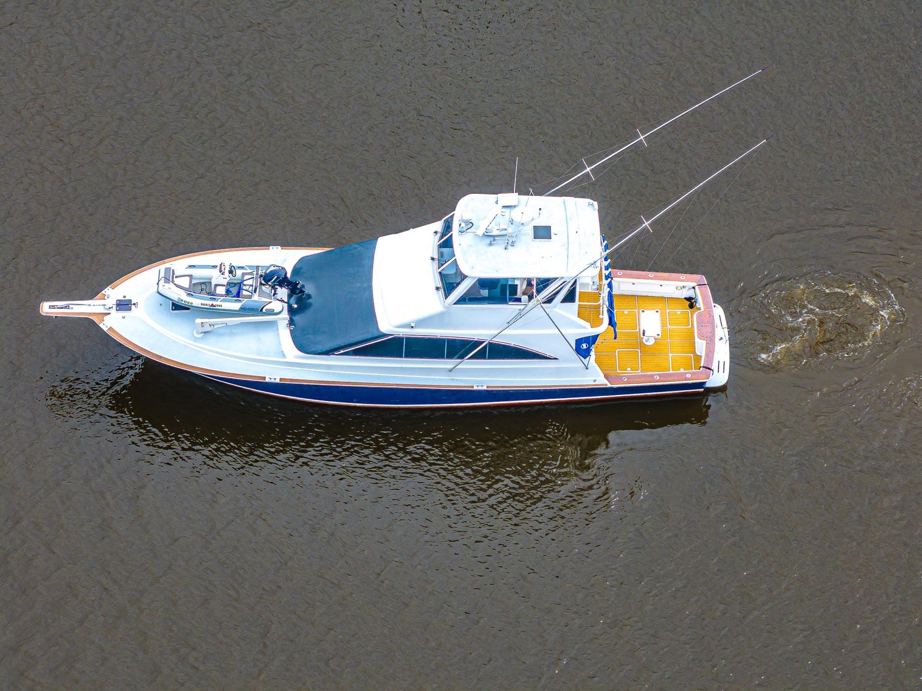 Aerial view of 1997 Ocean Yachts 60 Super Sport EB on calm water.