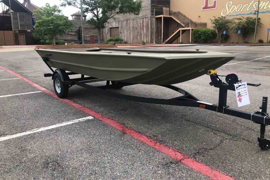 2026 Tracker Grizzly 1754 Utility boat on trailer in parking lot.