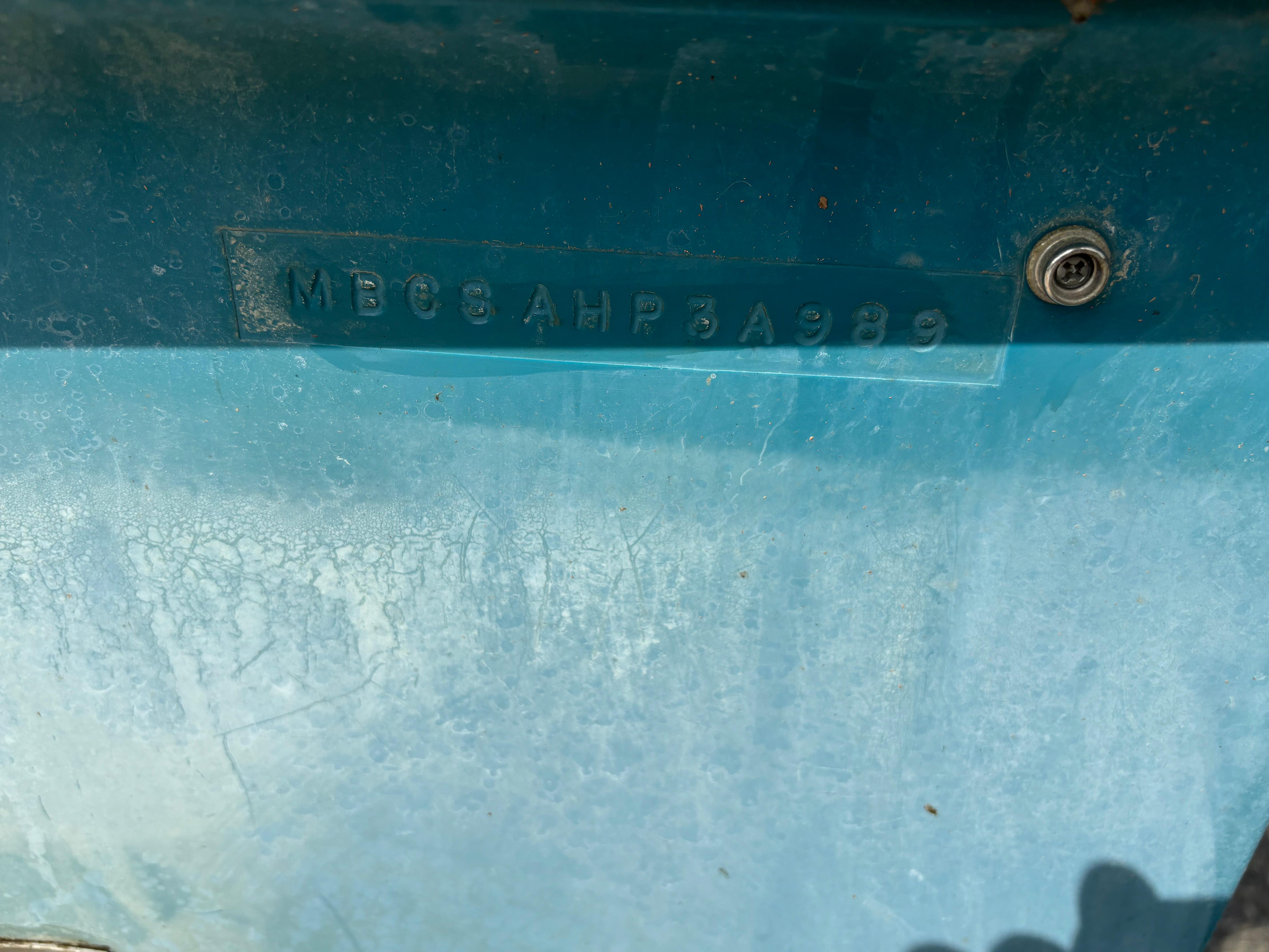1989 MasterCraft ProStar 190 boat hull identification number on blue surface.