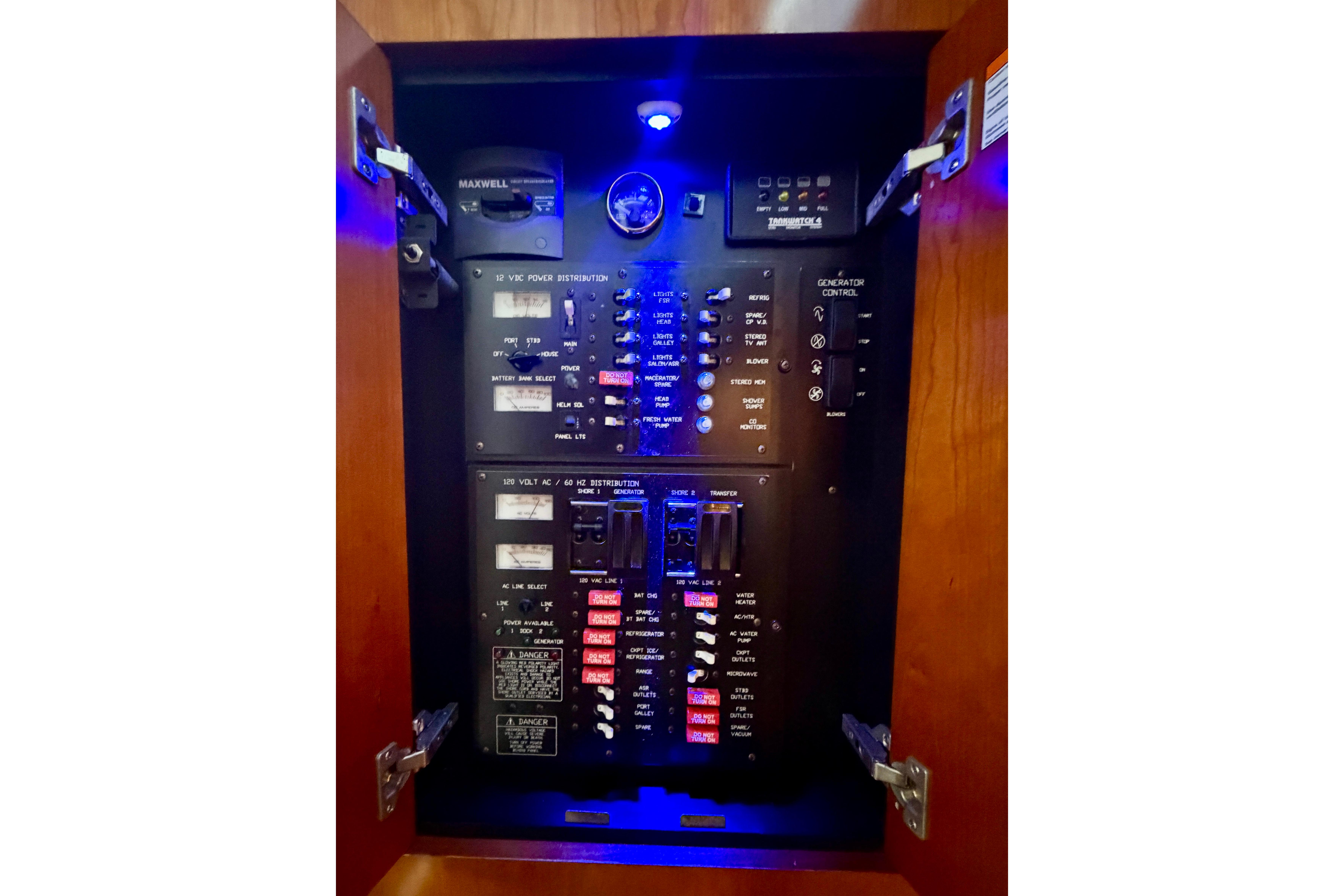 Electrical panel inside 2007 Cruisers Yachts 370 Express, featuring various controls and switches.