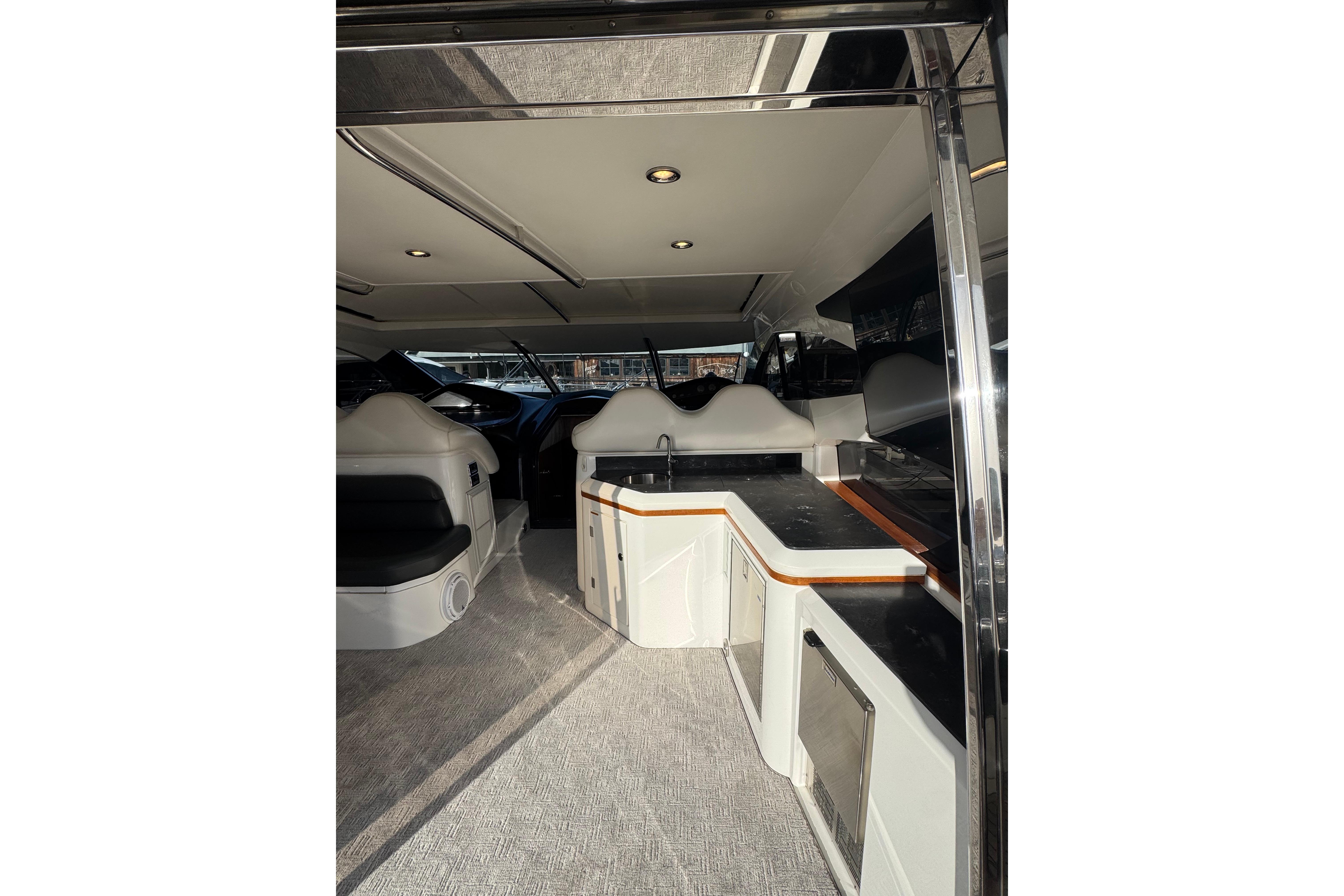 Interior of 2004 Sunseeker Predator 68 yacht with modern seating and sleek design.