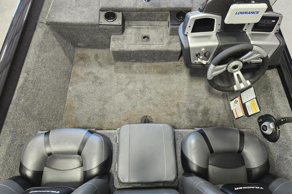 Interior of 2026 Tracker Pro Team 175 boat with steering wheel and seating.