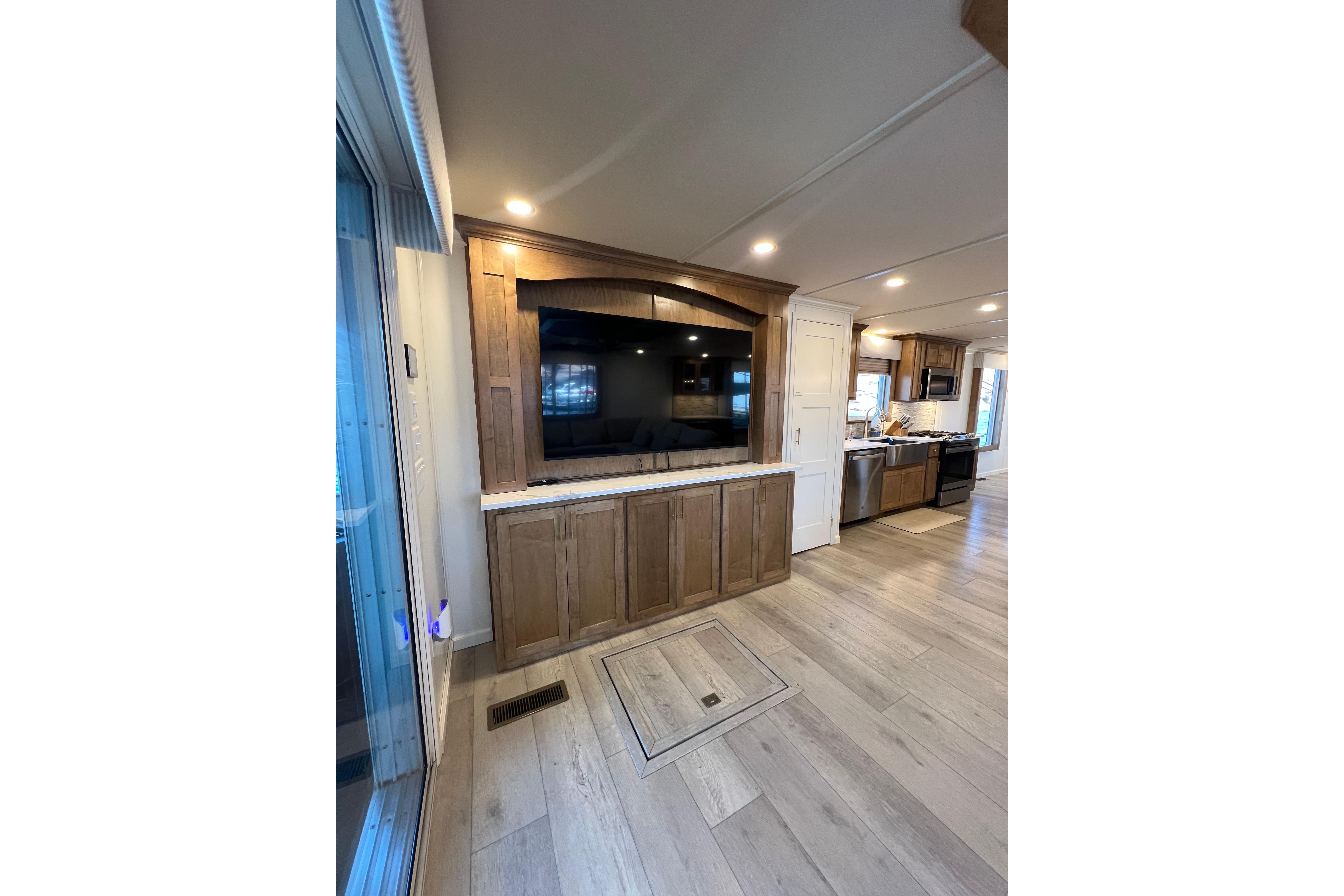 Modern kitchen interior in 2025 Sumerset Excellence Multiple Shares houseboat, featuring wood cabinetry and sleek appliances.