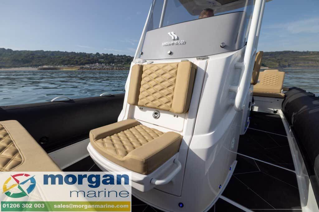 2026 Highfield Sport 800 boat with tan seating, on calm water, Morgan Marine branding.