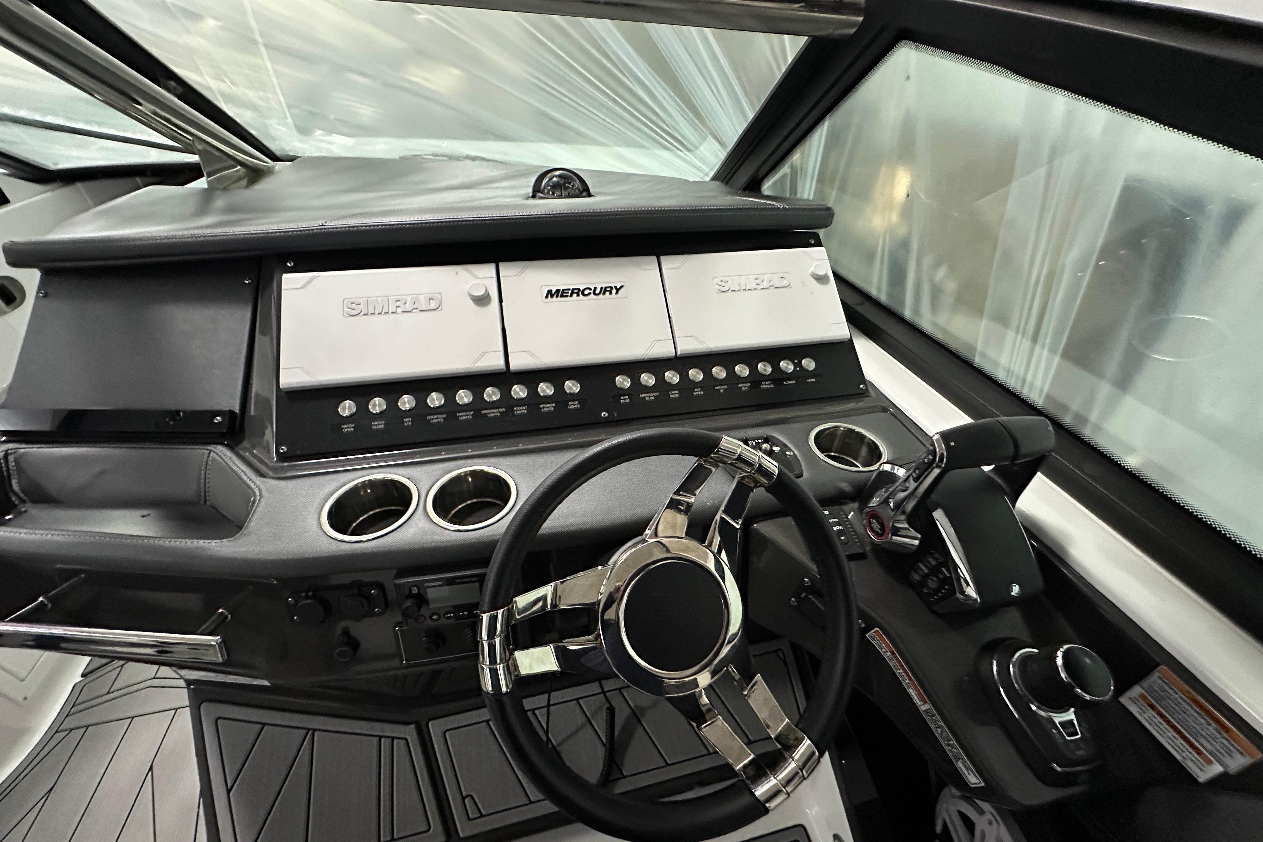 Cockpit of 2023 Monterey 378SS Super Sport boat with advanced controls and steering wheel.