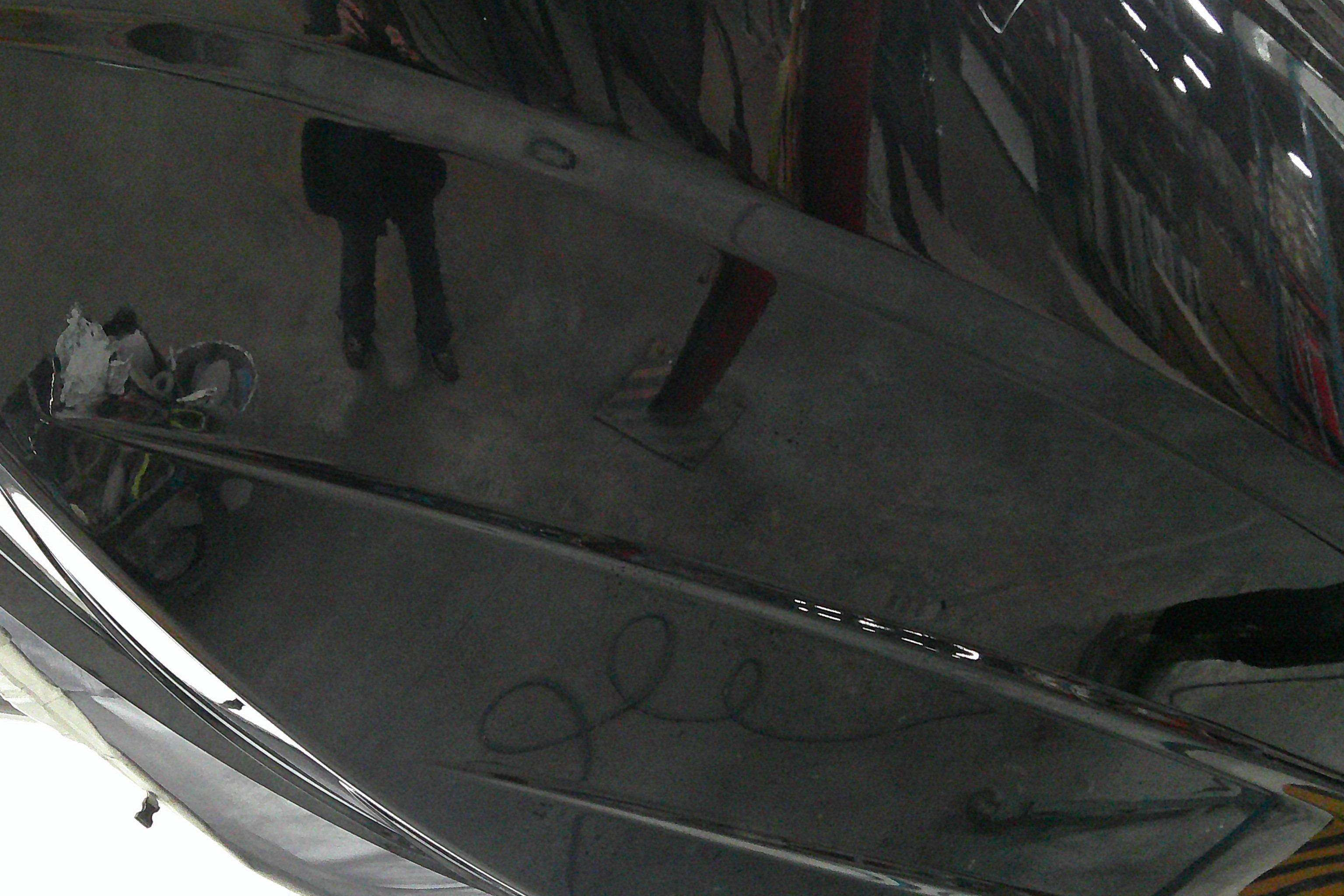 2025 Tahoe T18 boat with sleek black finish in a workshop setting.