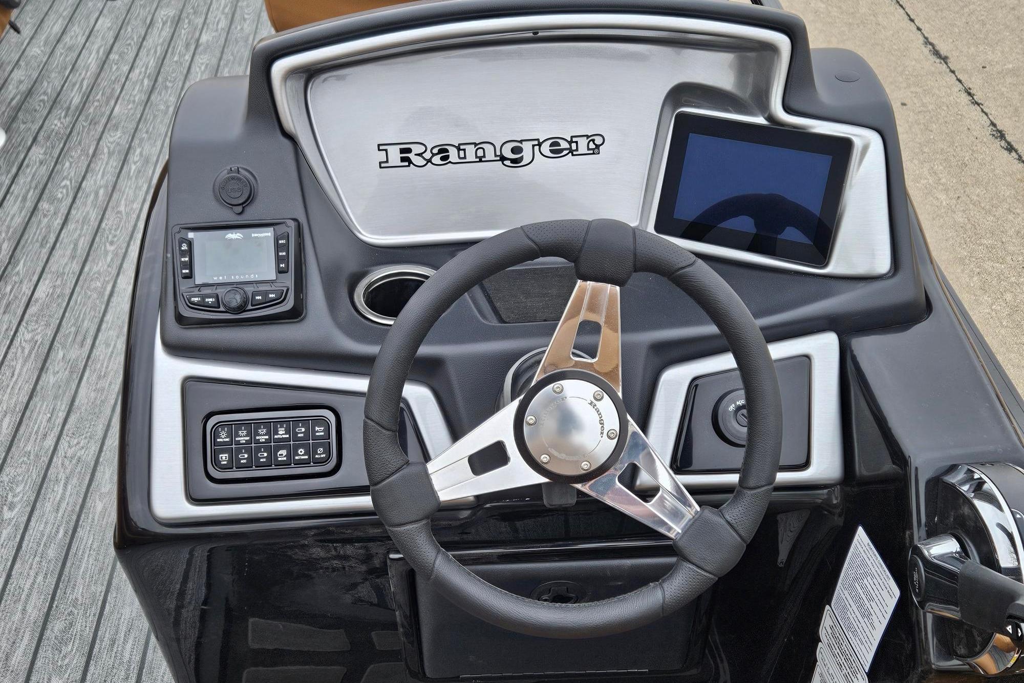 2026 Ranger 220F boat dashboard with steering wheel and electronic controls.