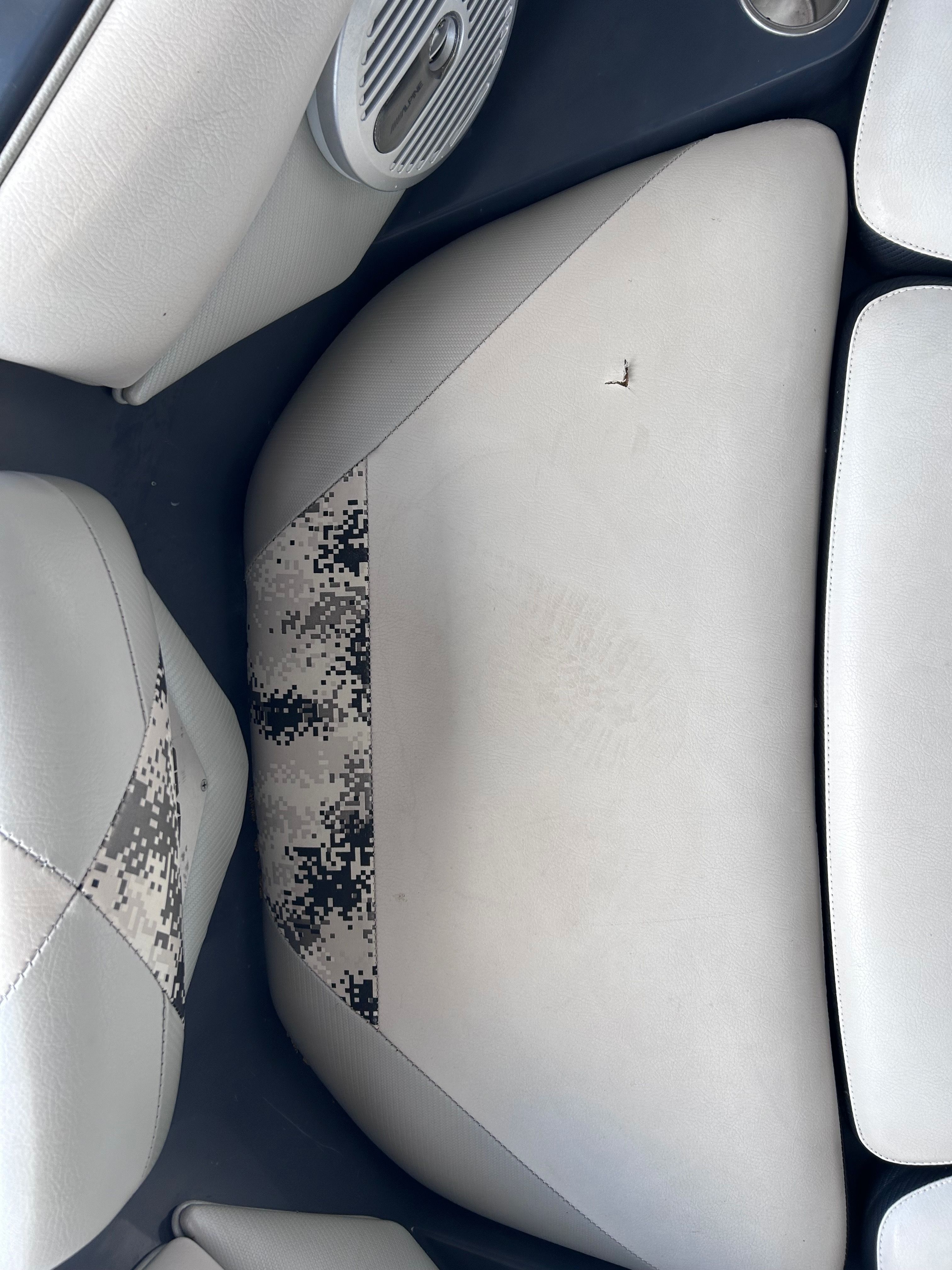 Interior of Axis A22 boat, seat upholstery with digital camo pattern.